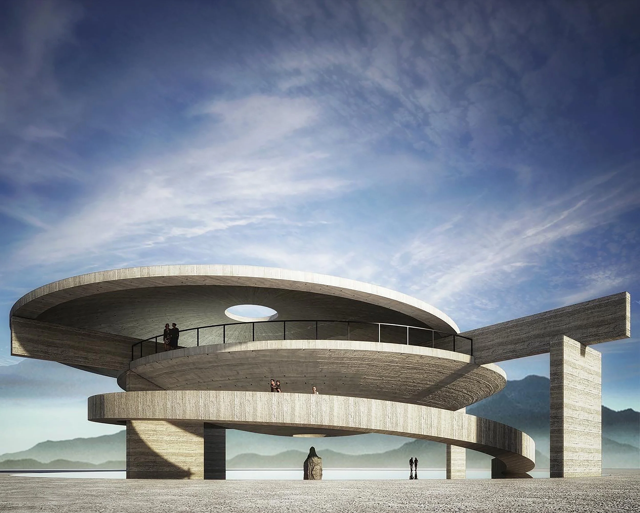 A multi-level circular concrete structure with open spaces and railing, set against a clear sky with wispy clouds and distant mountains.