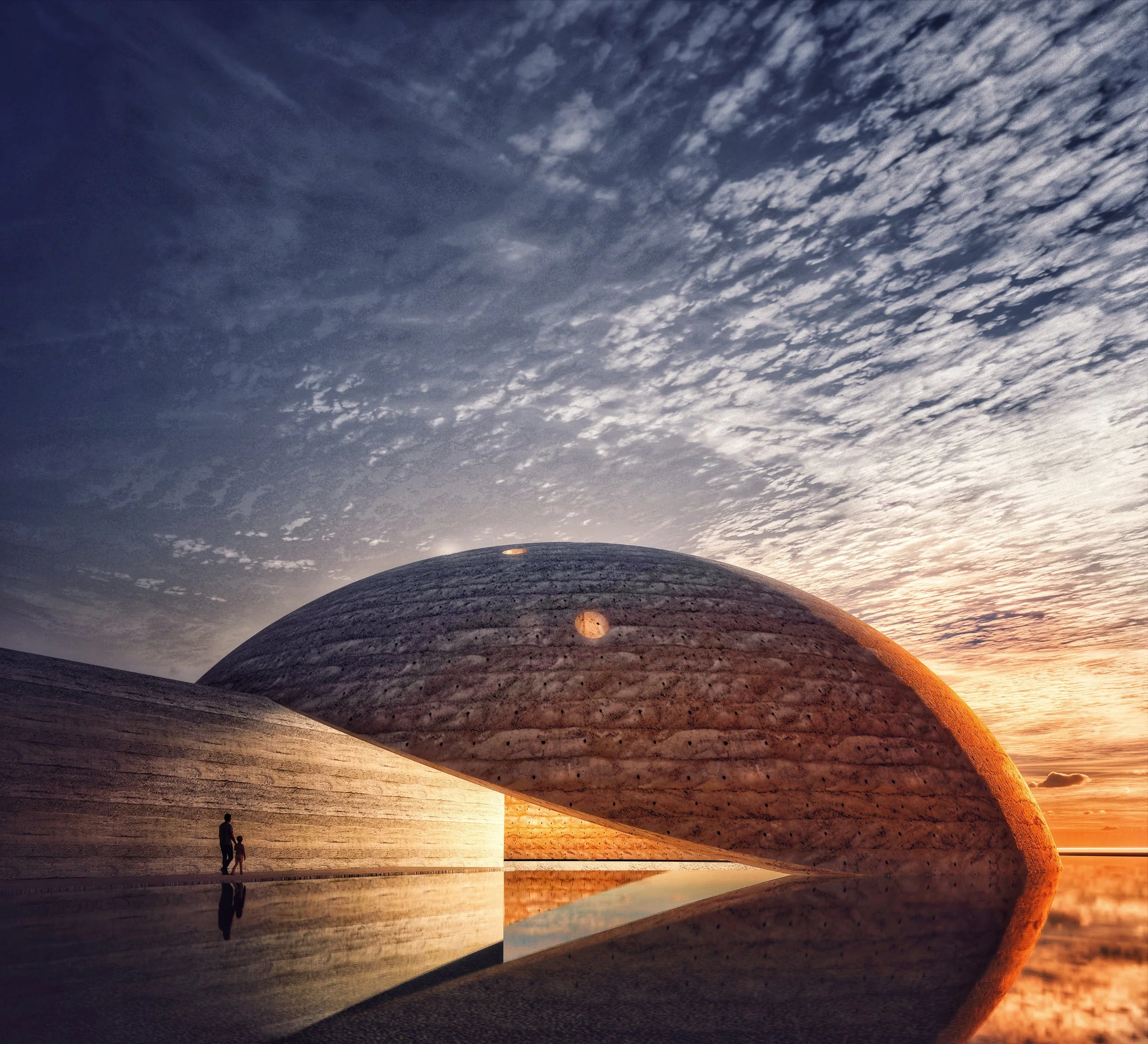 Large smooth rocks with a textured surface at sunset, with two people standing near the rocks and a reflective pool of water nearby, under a cloudy sky.