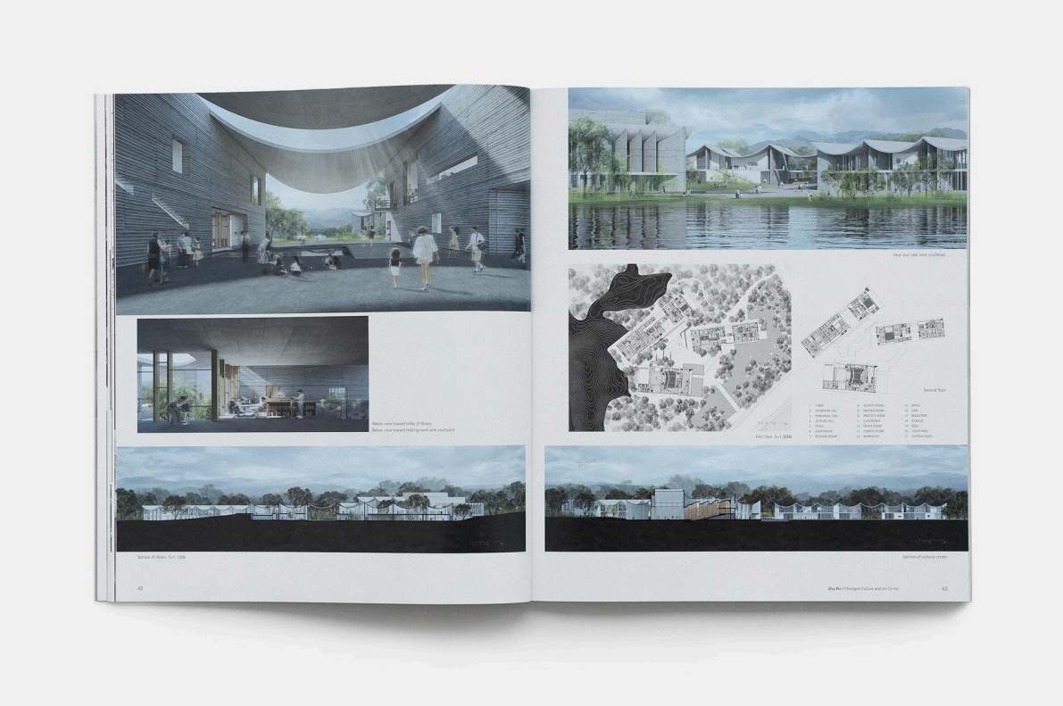 Open architectural book showing digital renderings, diagrams, and plans of a modern cultural and art center with a water feature and surrounding landscape.