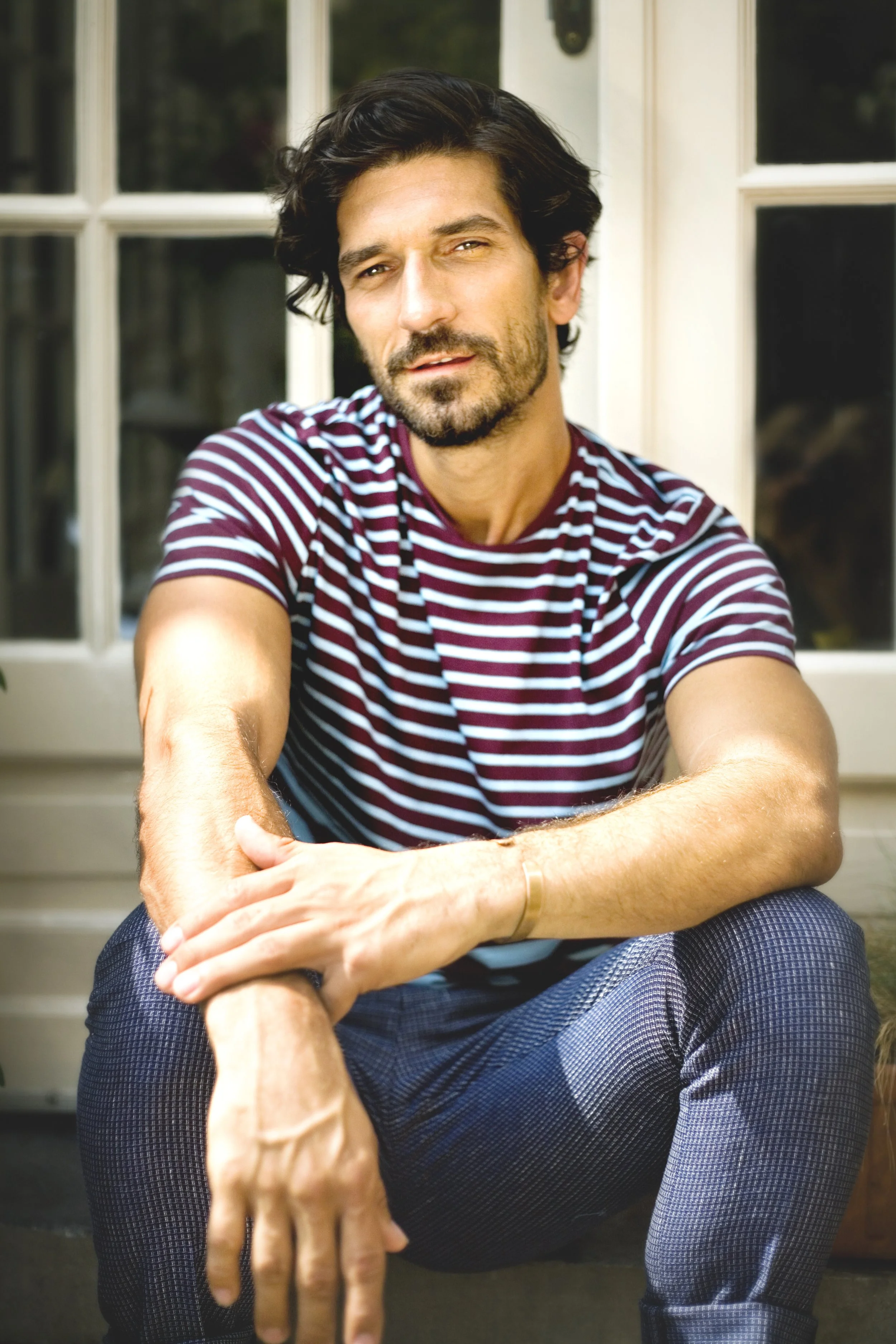 brand imagery for olivier strelli showing a handsome man showing the winter collection shot by atelier soufflé