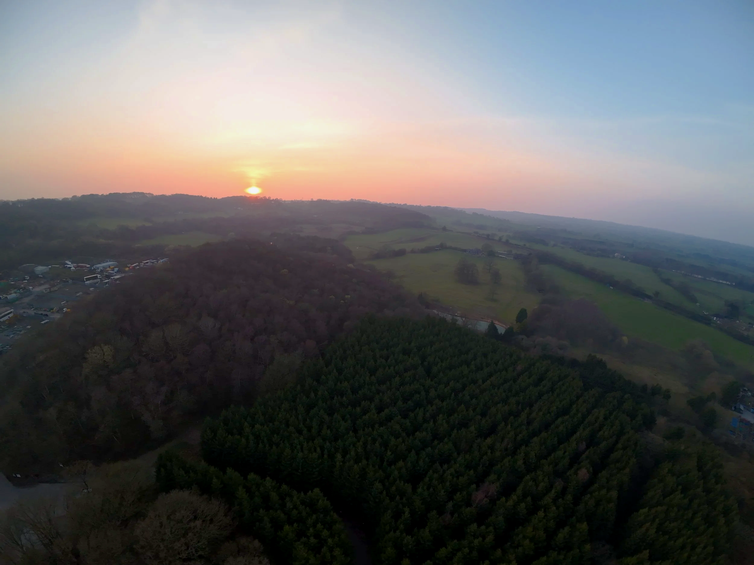 High‑altitude aerial drone photography at sunset over Hillside Fishing Pool on Cheadle Road, Stoke‑on‑Trent