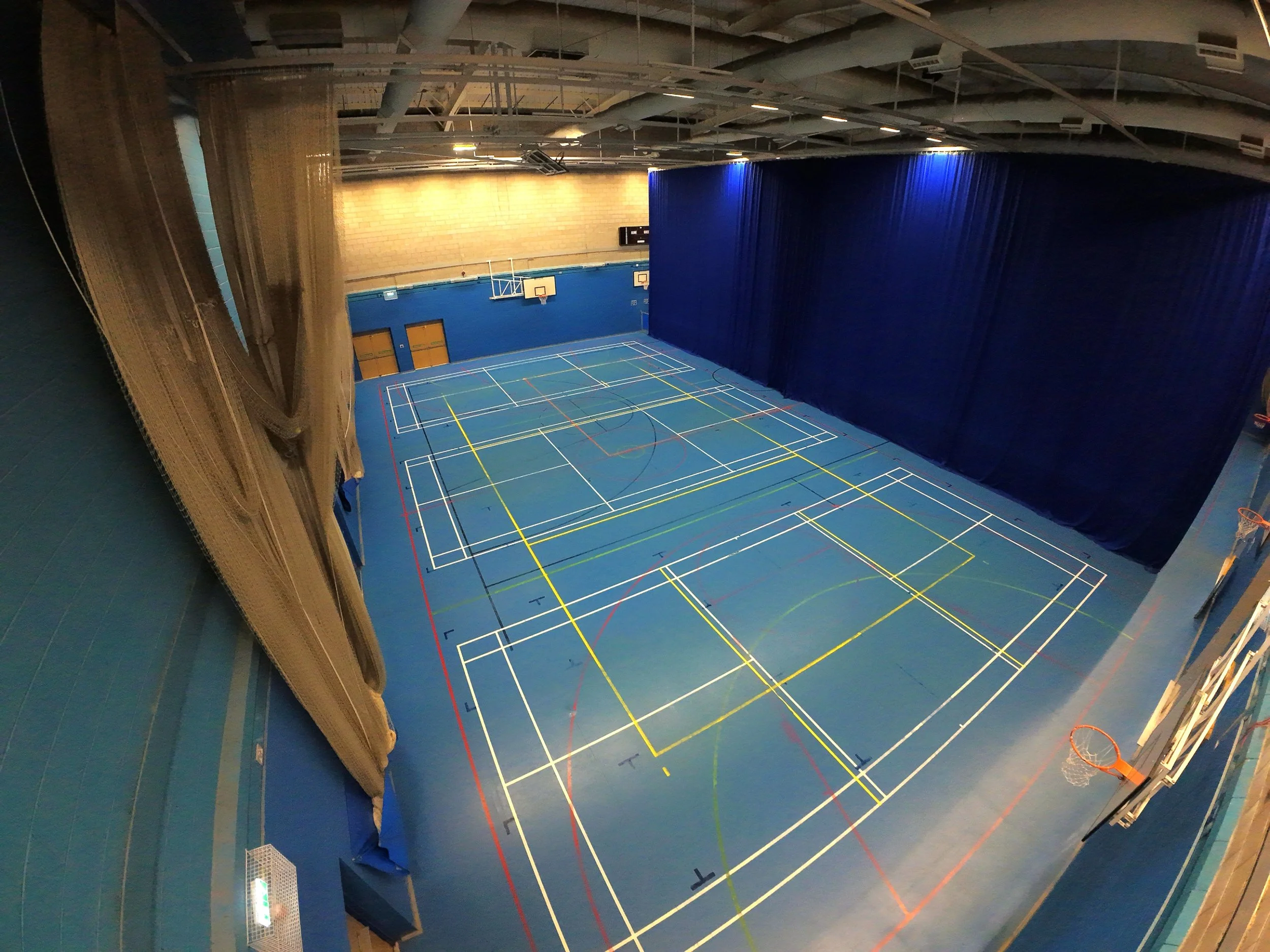 Indoor aerial drone photography of the small sports hall at Fenton Manor Sports Complex, captured from the corner for event coverage