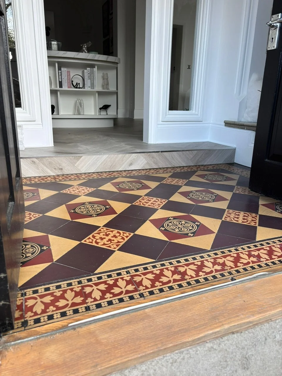 View of a decorative Victorian tile floor at an entrance, beautifully restored by the Bedford Victorian Restoration team.