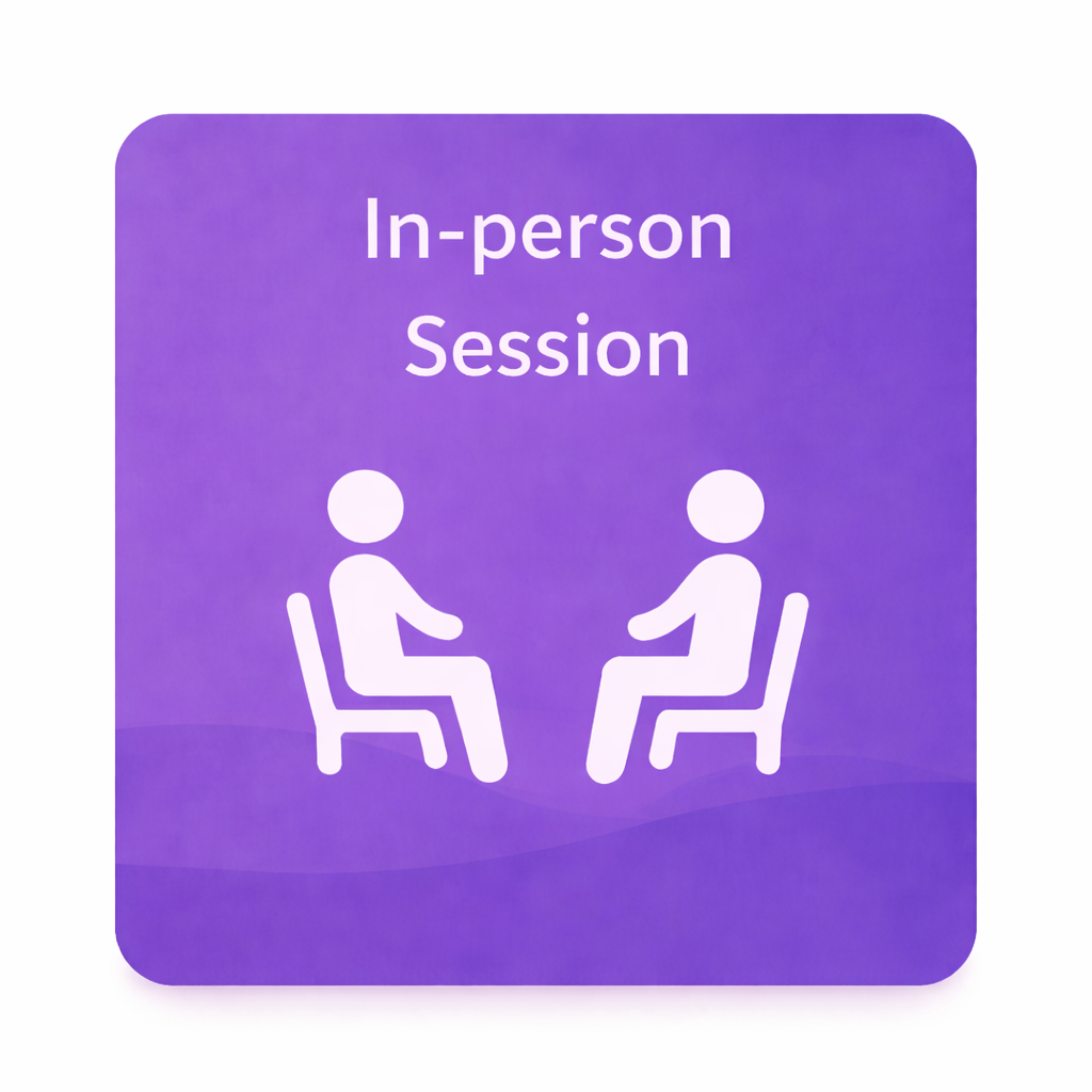 A purple sign with white text that reads 'In-person Session' and shows two simplified human figures sitting on chairs facing each other.