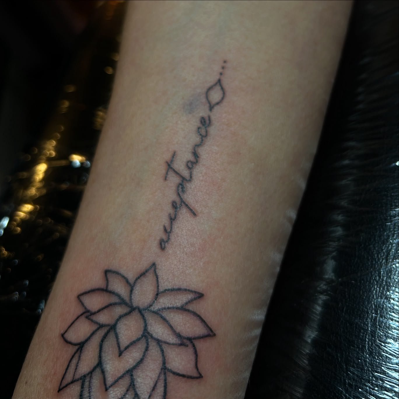 Custom script and lotus tattoo
