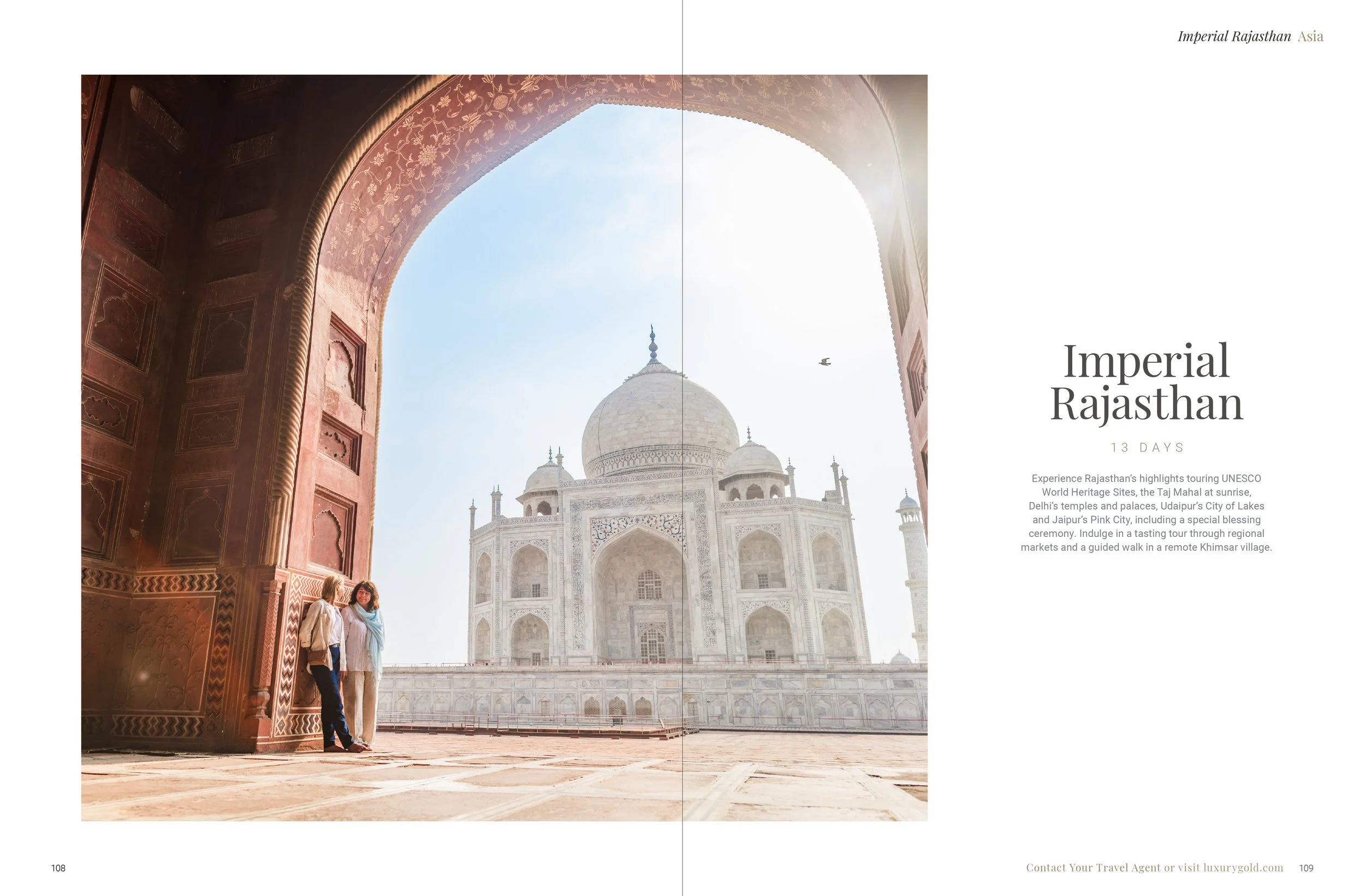 Visitors viewing the Taj Mahal through an archway in India at sunrise.