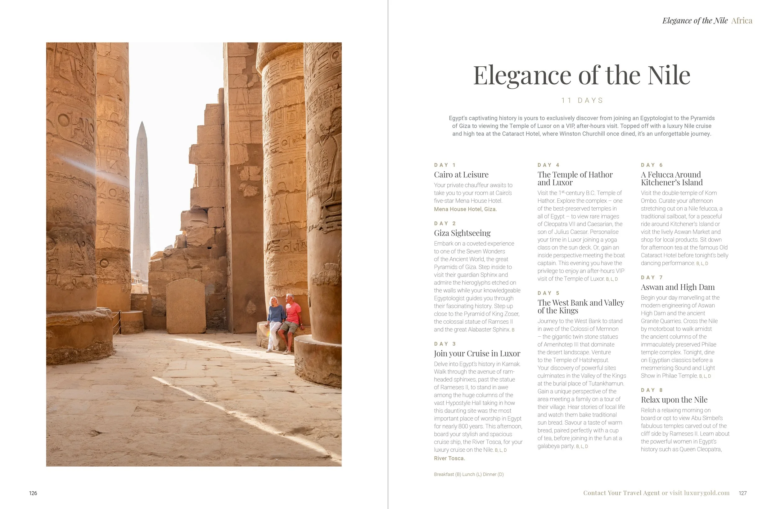 Photo of ancient Egyptian columns with hieroglyphics, ancient obelisk, and two tourists sitting among the ruins.