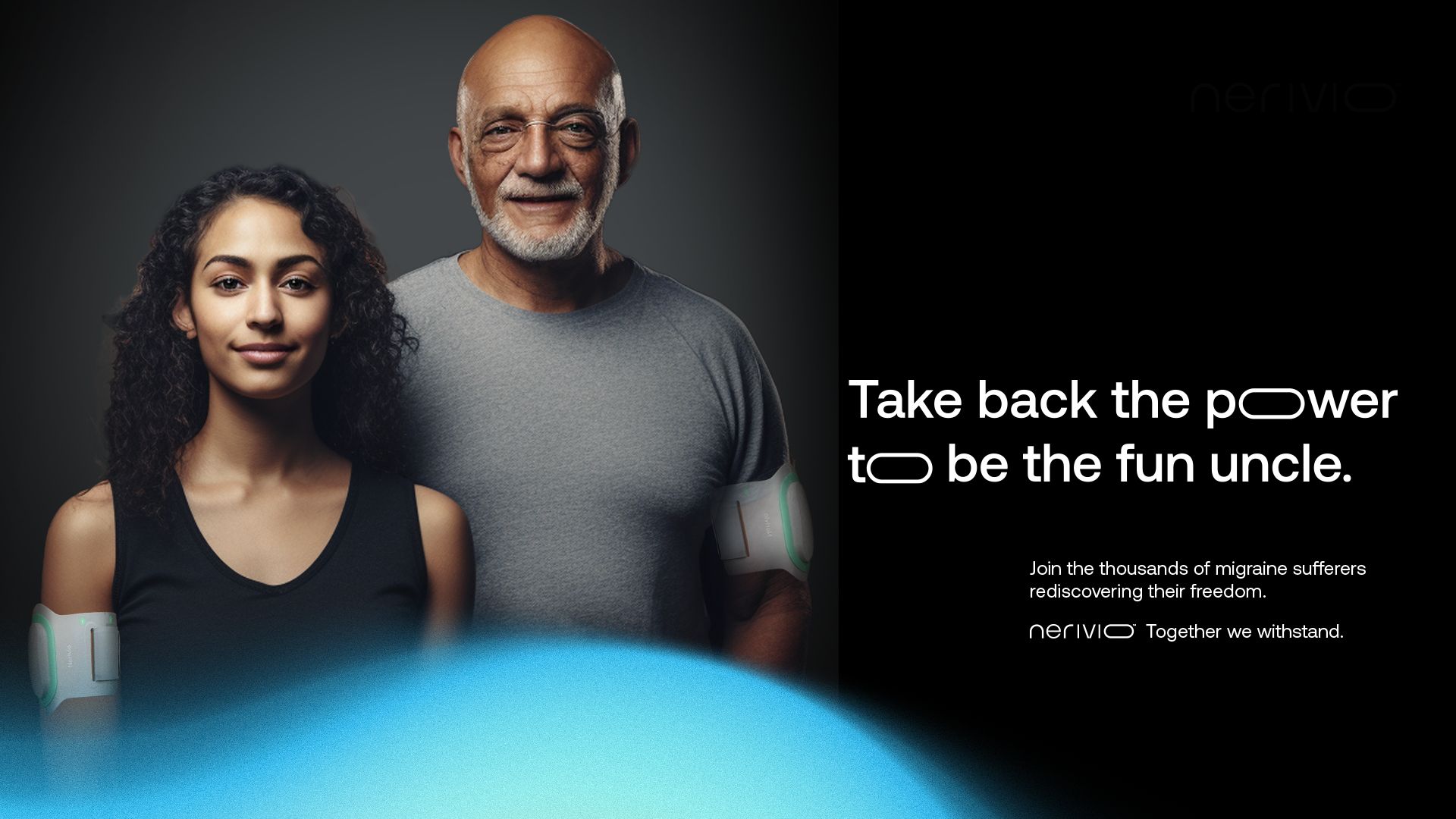 A young woman and an older man, both wearing migraine relief devices on their arms, stand together against a dark background. The woman has curly hair and a slight smile, while the man has a beard, glasses, and a friendly expression.