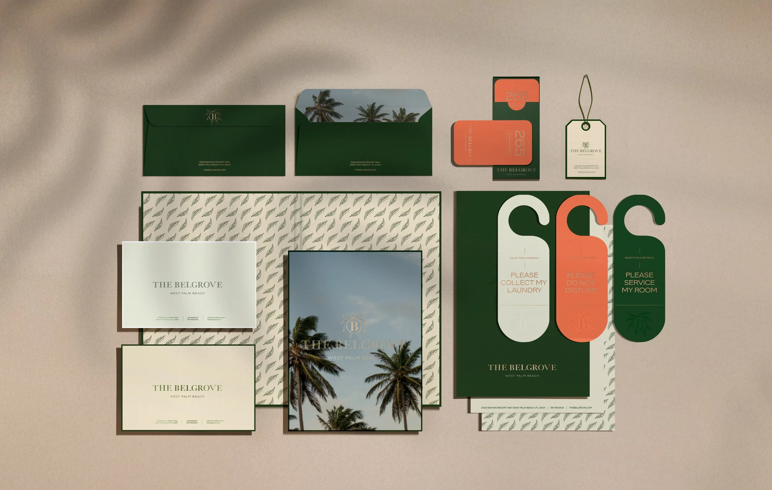 Collection of branded stationery and tags for The Belgrave resort, including envelopes, cards, tags, and signs with palm tree imagery and text indicating resort amenities and policies.