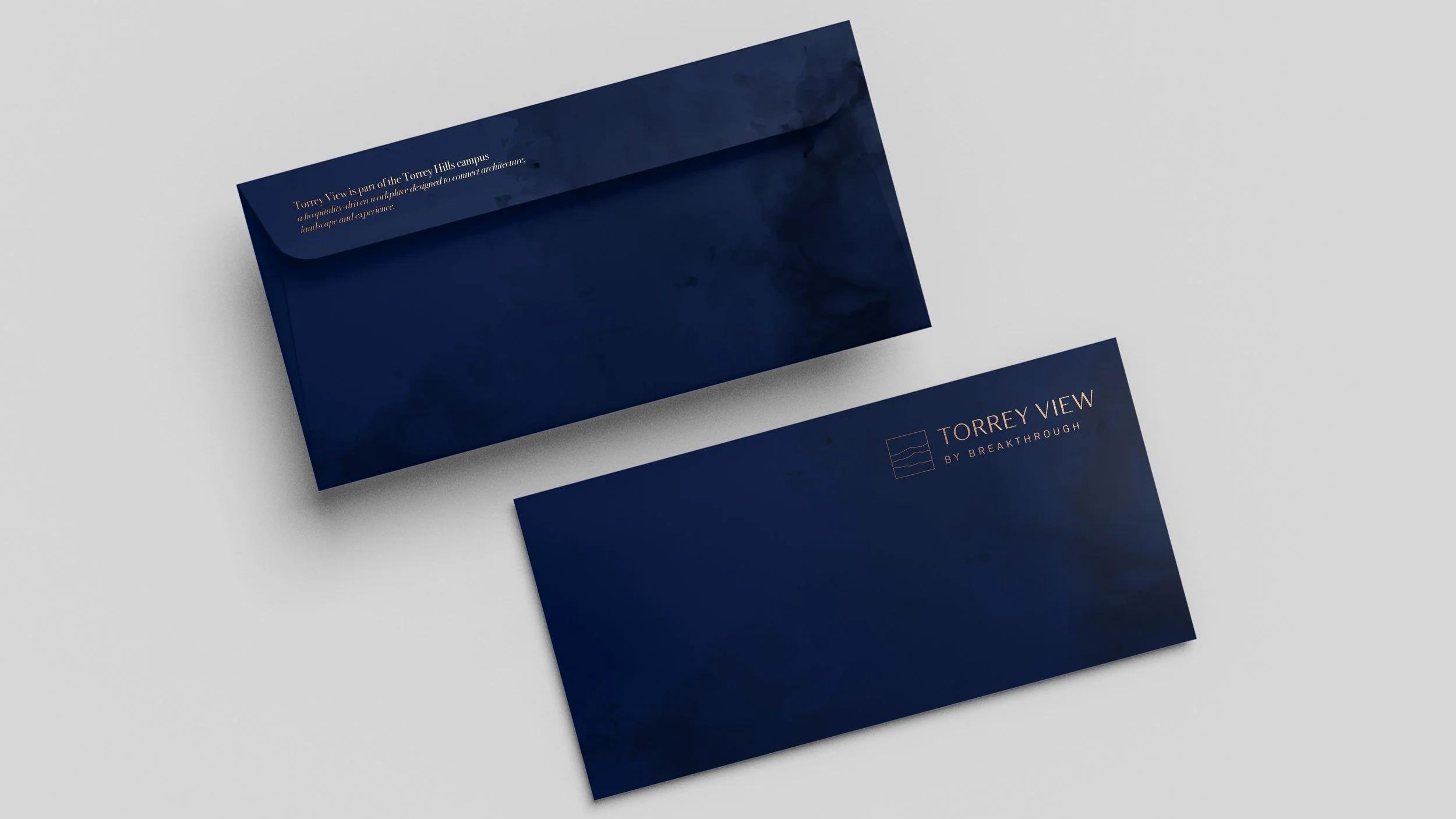 Dark blue promotional card and envelope for Torrey View by Breakthrough, with minimalistic design and gold text.