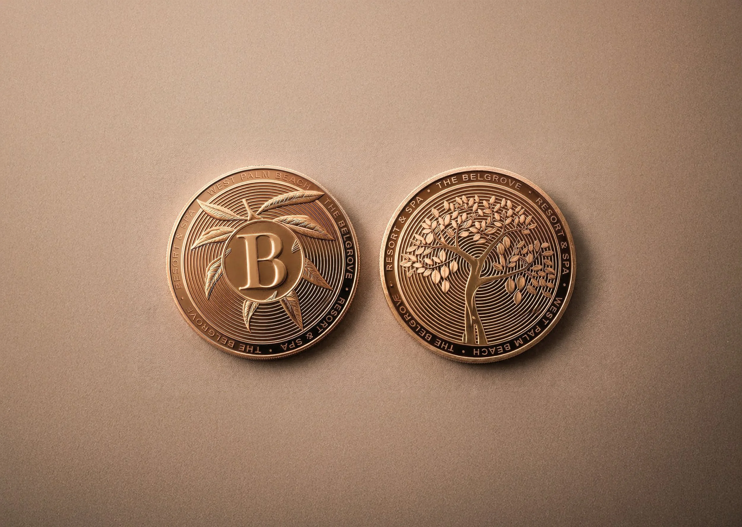 Two rose gold coins, one with a letter B and leaves design, the other with a tree with many leaves, both featuring the words 'Resort & Spa, The Belgrave, West Palm Beach' around the edges.