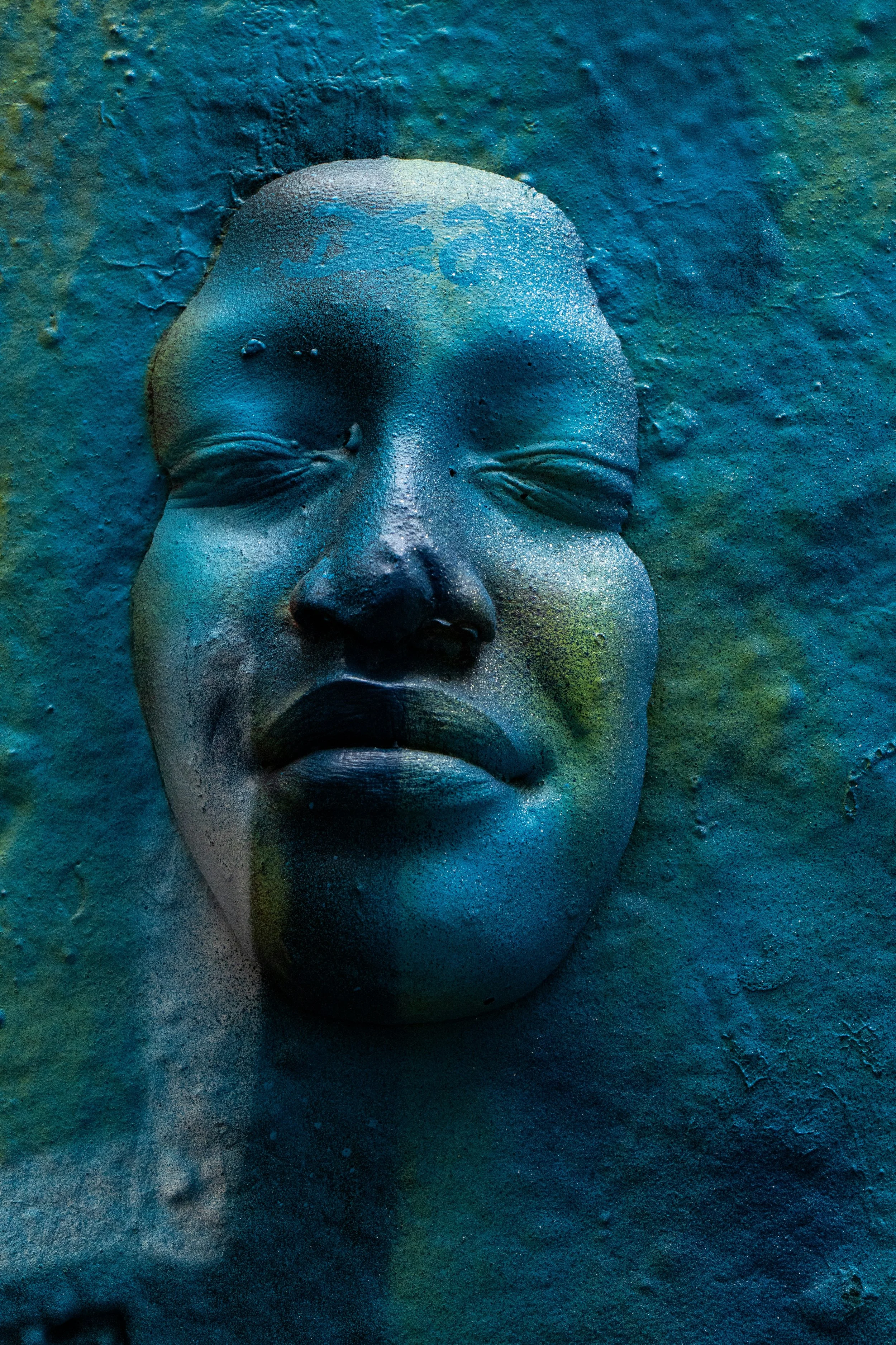 A turquoise face emerging with a gentle smile, symbolising hope and emotional support for SEND parents.