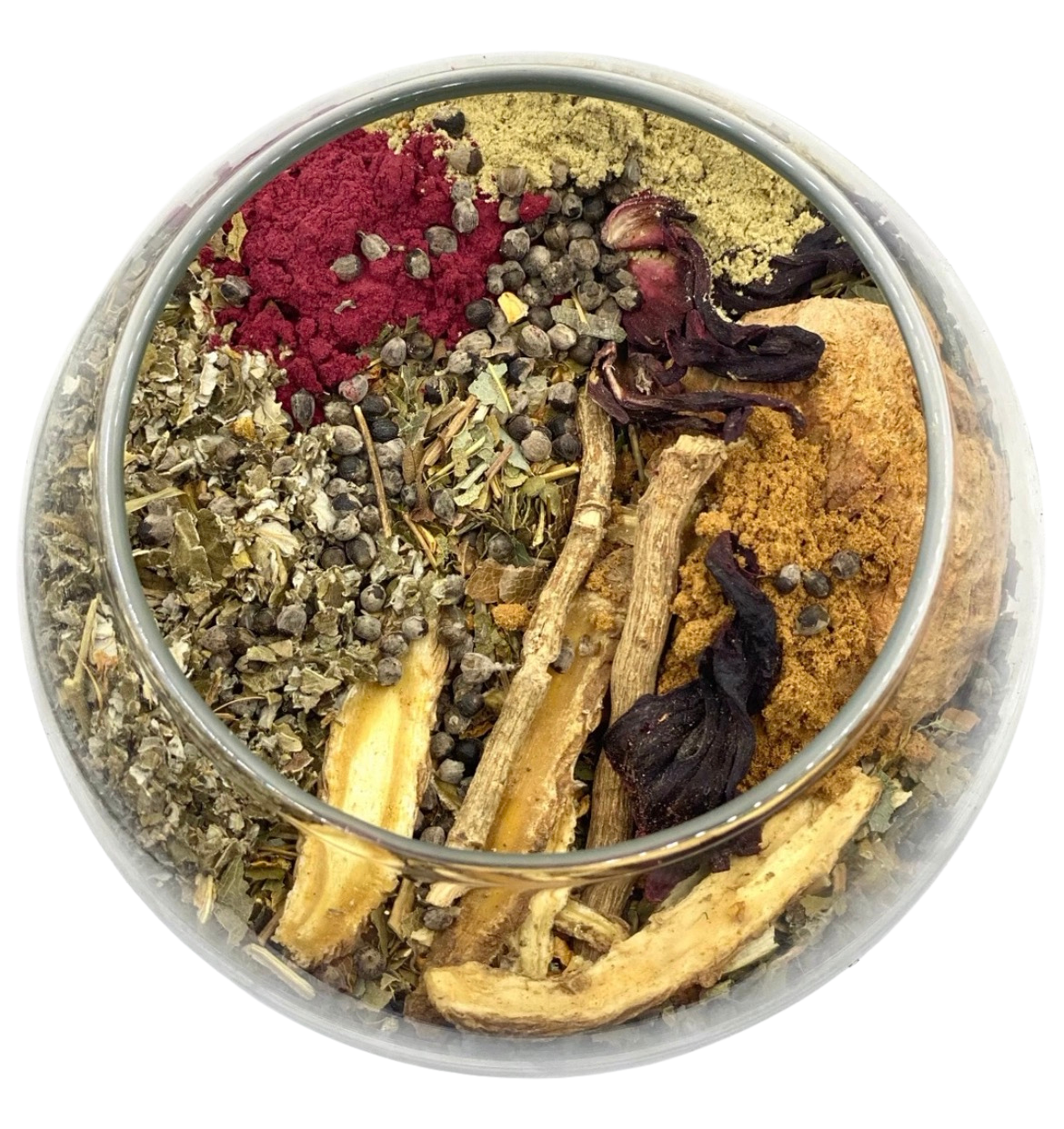 A round container filled with various dried herbs, roots, and spices, including red and yellow powders, seed clusters, and dark dried flowers or pods.