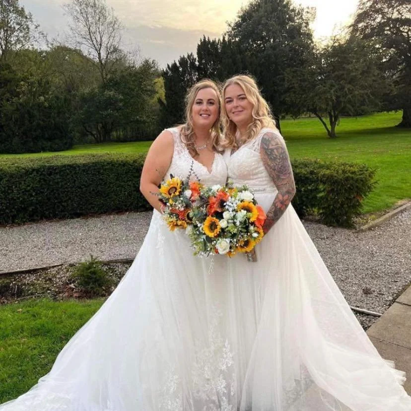 AN image of our happy brides, Lauren and Vicky, on their wedding day