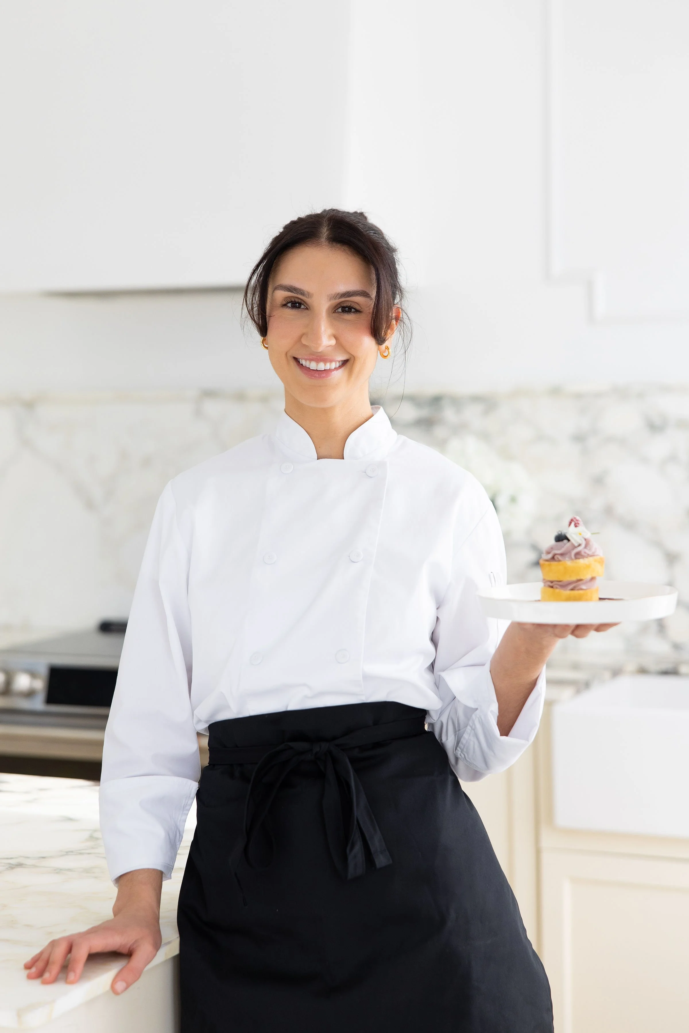 Chef Danielle of In Good Company, a private chef in Rhode Island and Massachusetts, preparing a luxury dining experience in a home kitchen