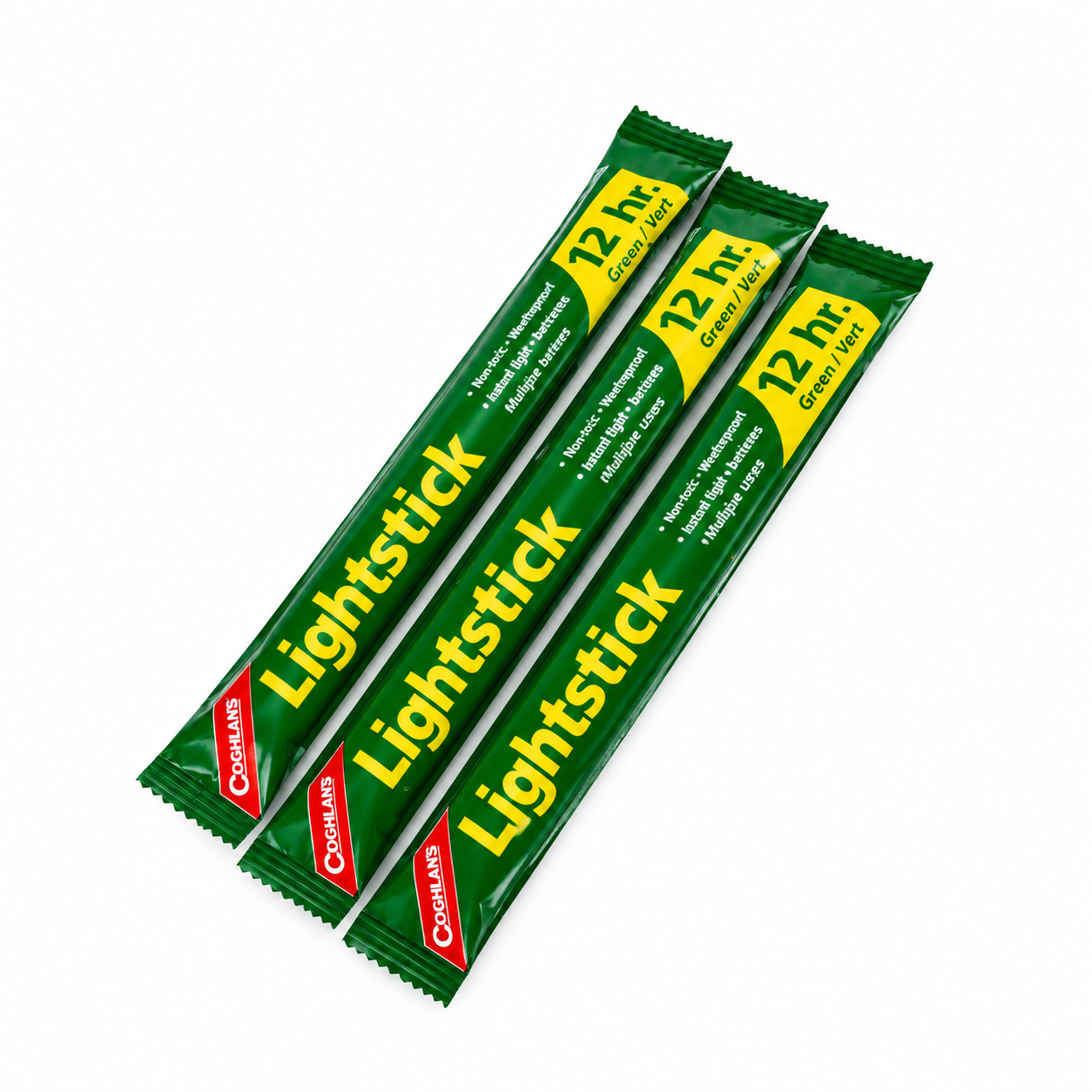 Three unopened Coghlan’s 12-hour green lightsticks in individual wrappers on a white background