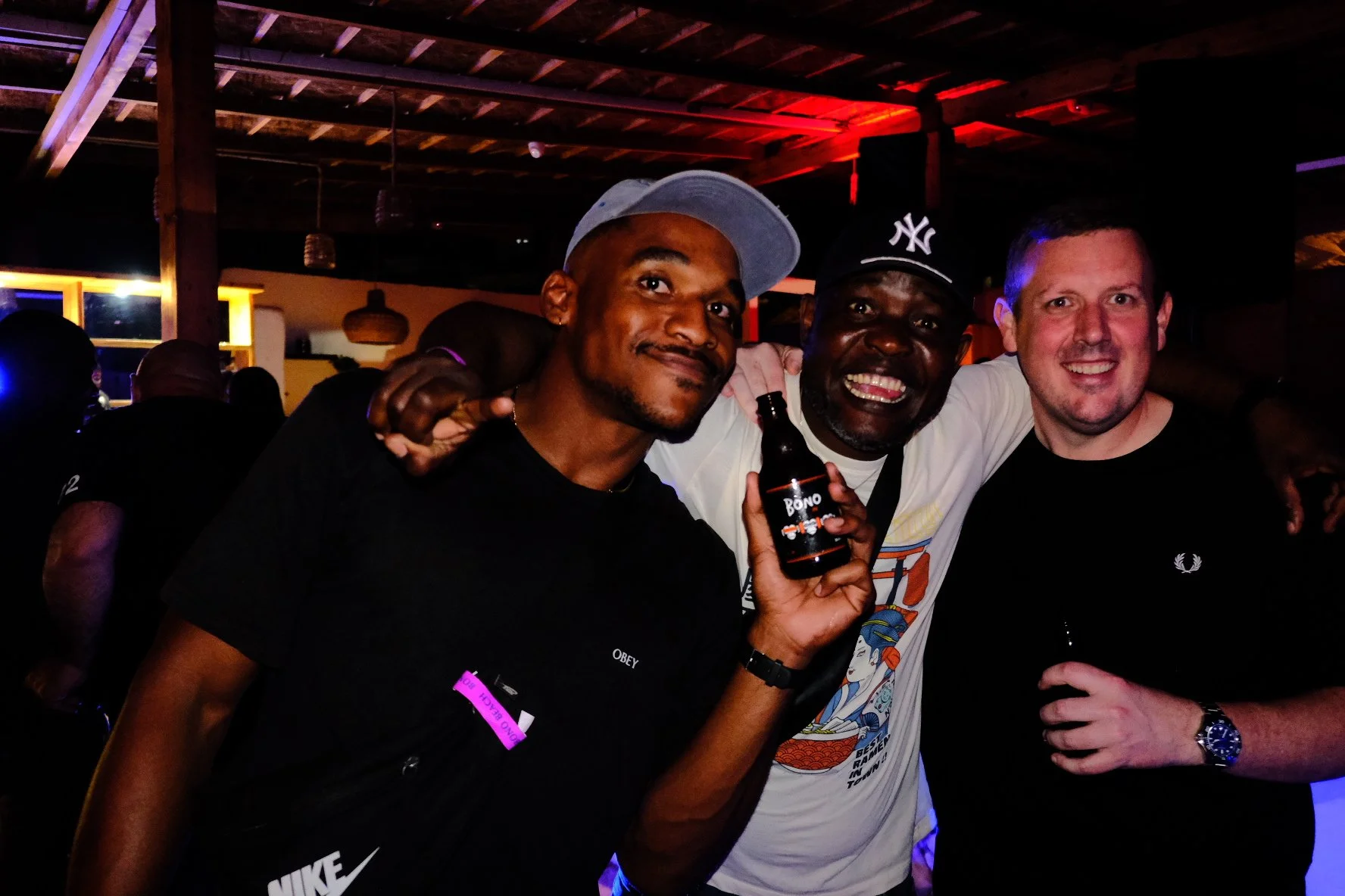 3 men having a good time at a party