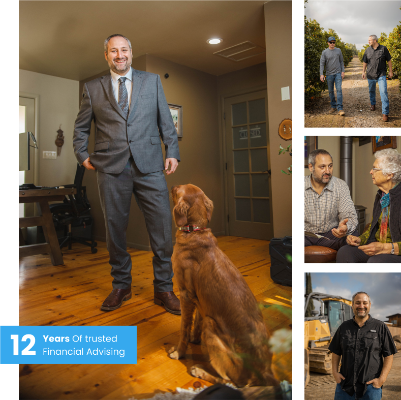 A man in a gray suit and tie smiling at a golden retriever sitting on a wooden floor inside a house.
