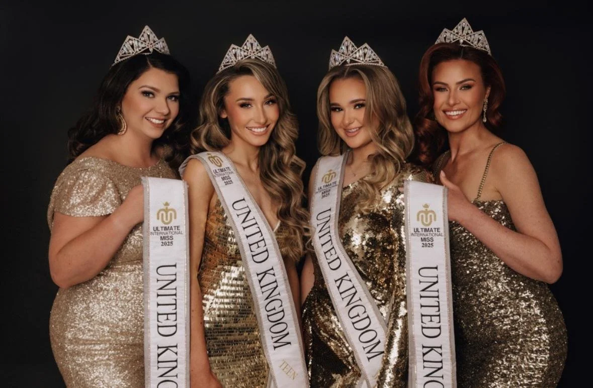 Four beauty pageant contestants wearing tiaras and sashes that say "United Kingdom" with gold and silver dresses, standing against a black background.