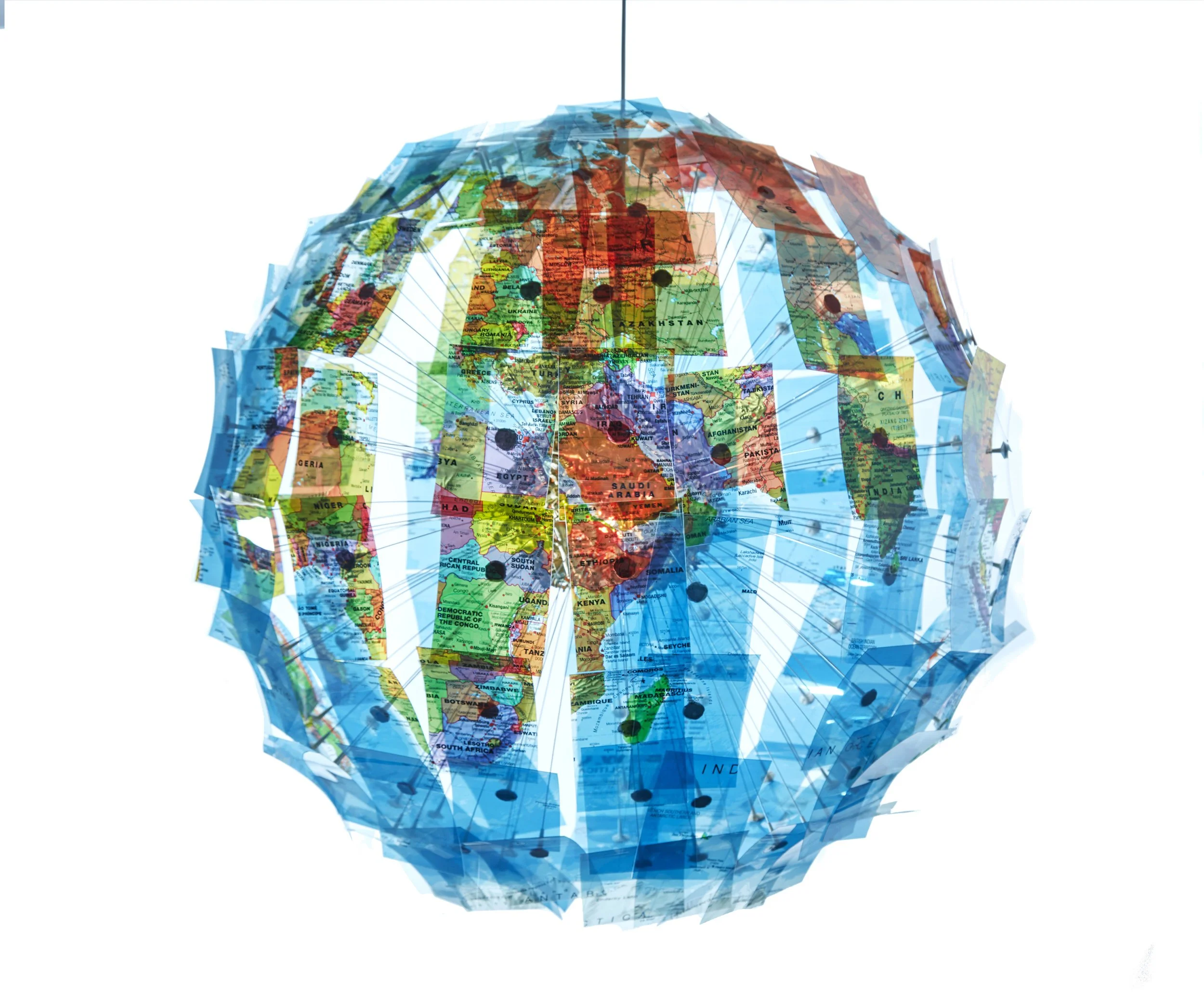 Gravitational Pull, 2019
Map transparencies, metal light, cord