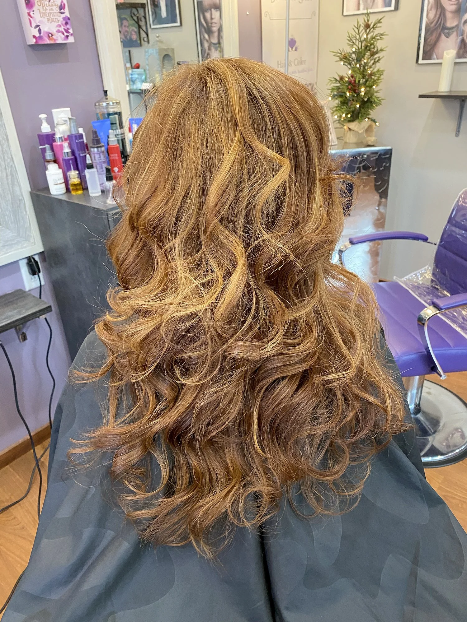 Long hairstyle with waves and highlights.