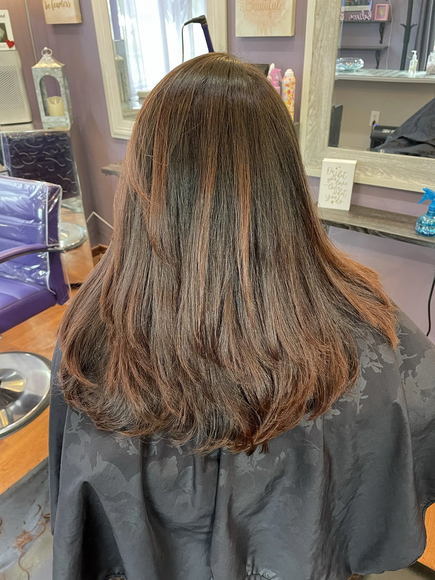 Long brunette hairstyle with dimensional highlights