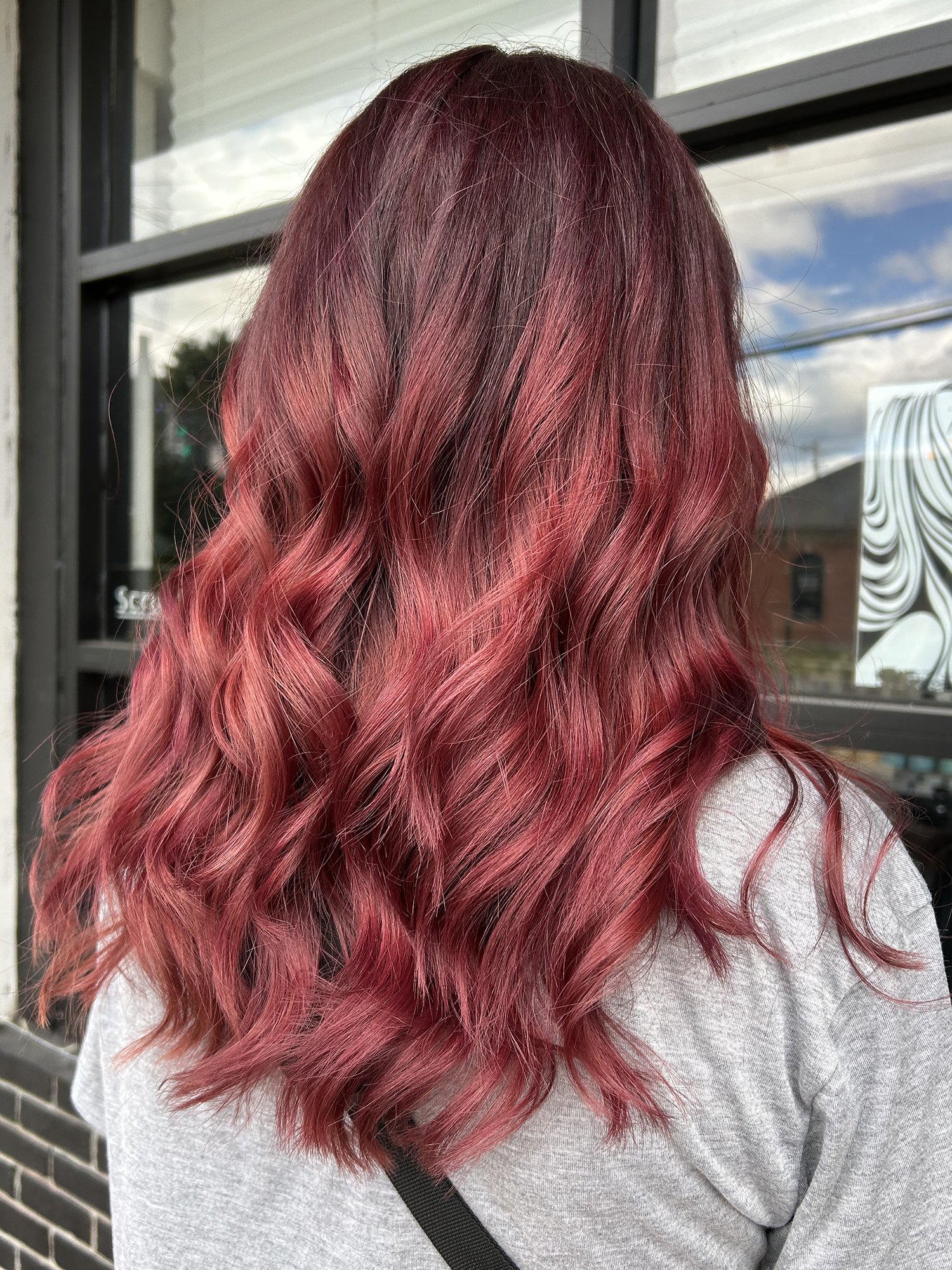 Bright red hairstyle with waves.