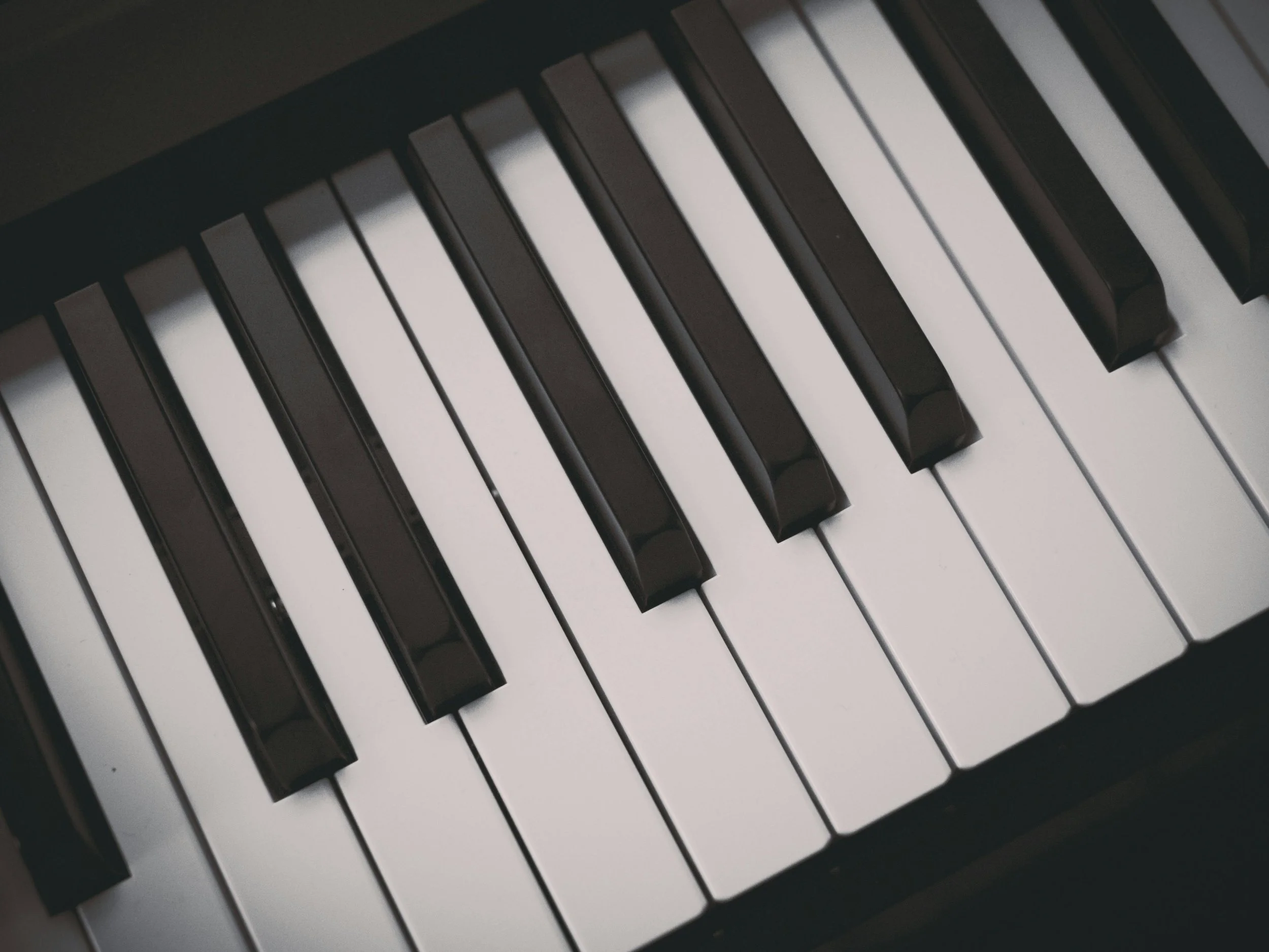 Close-up photograph of black and white piano keys.