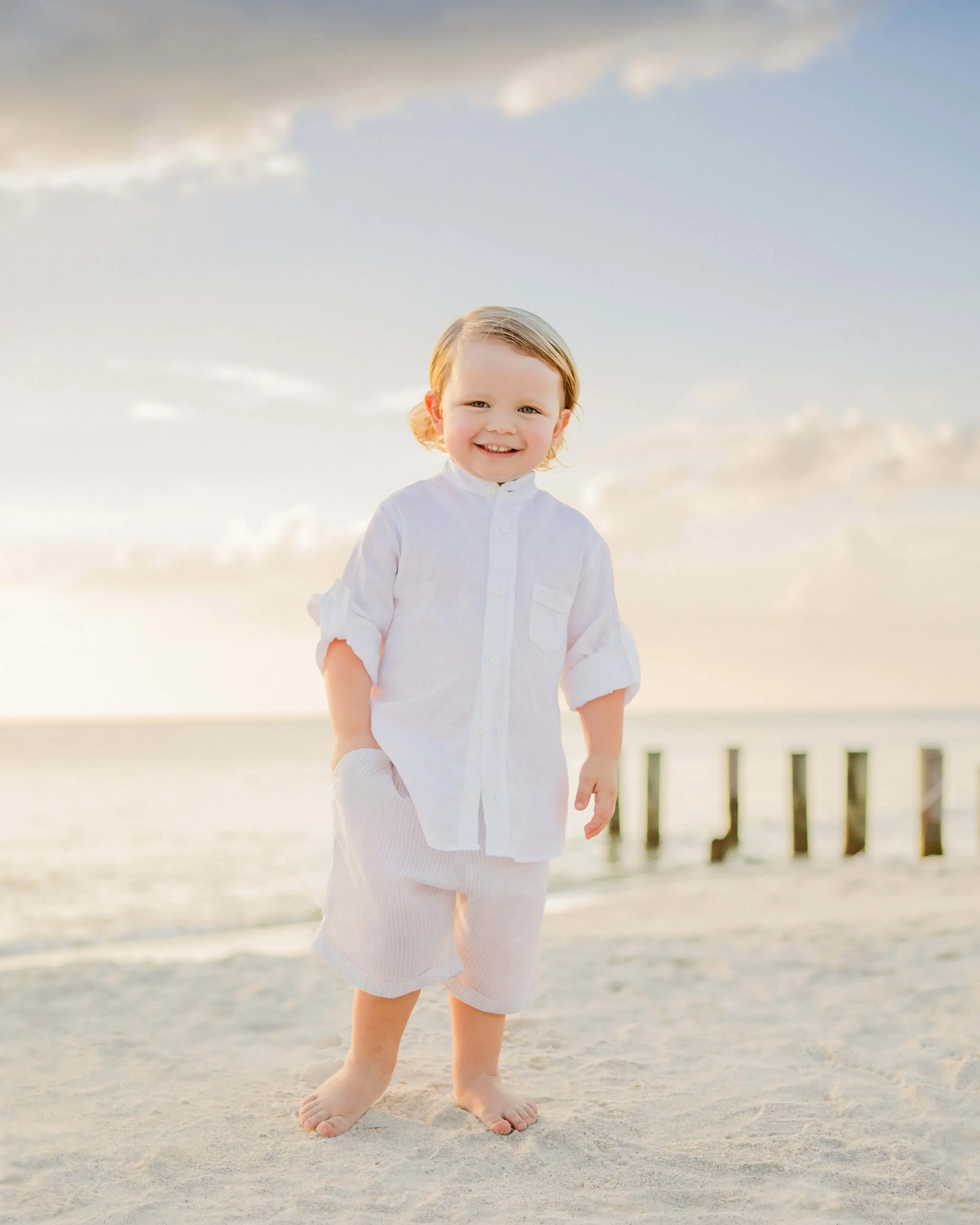 Toddler boy beach portrait at sunset in Naples Florida photographed by Savor Photography