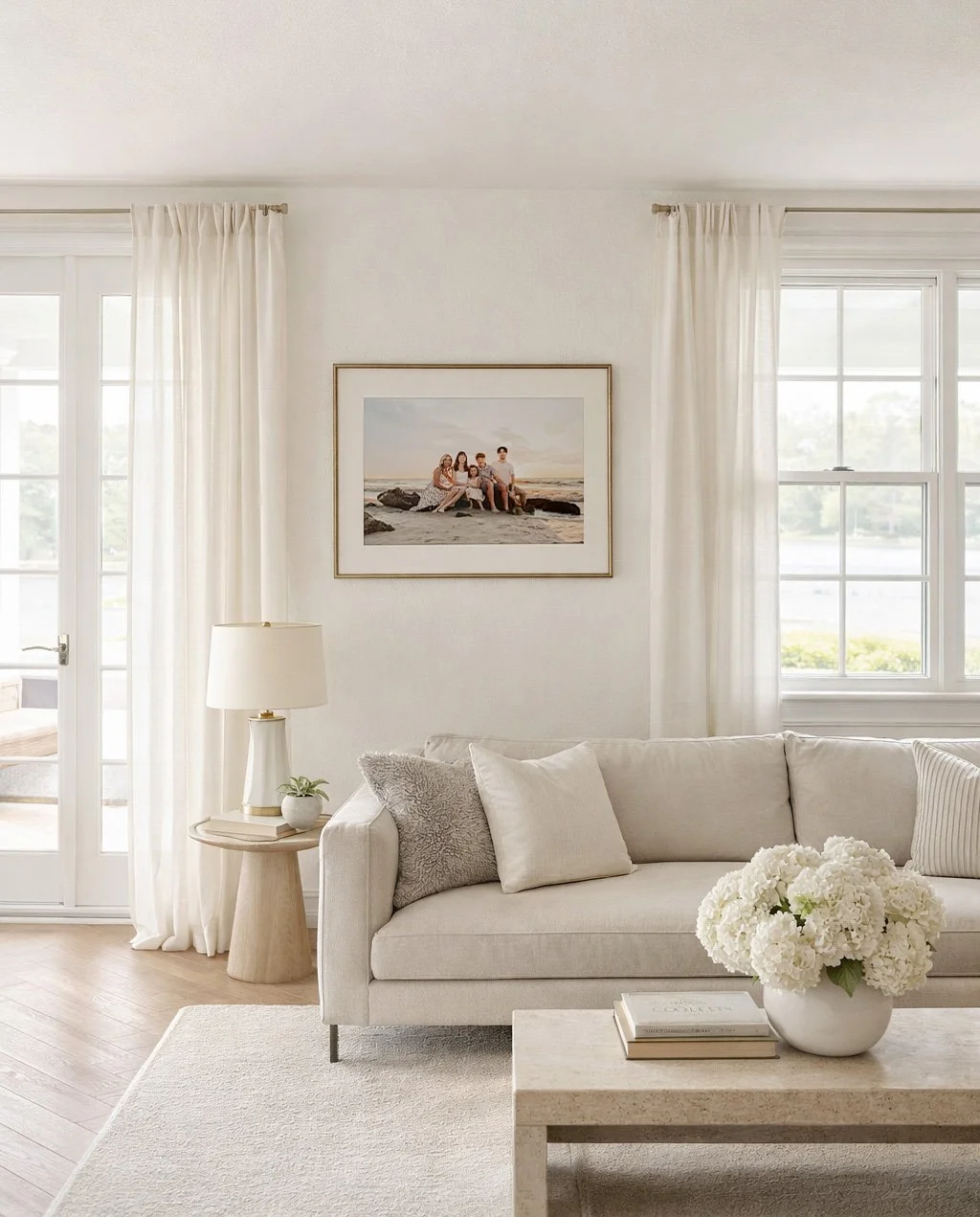 Framed Naples family beach portrait displayed in a refined neutral living room.