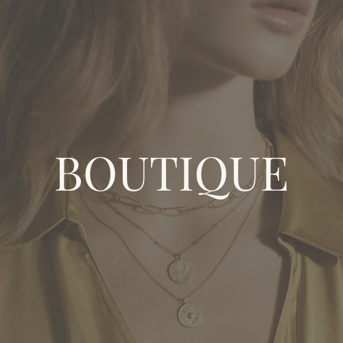 Close-up of woman wearing layered gold necklaces and a satin jacket with the word 'BOUTIQUE' overlaid.