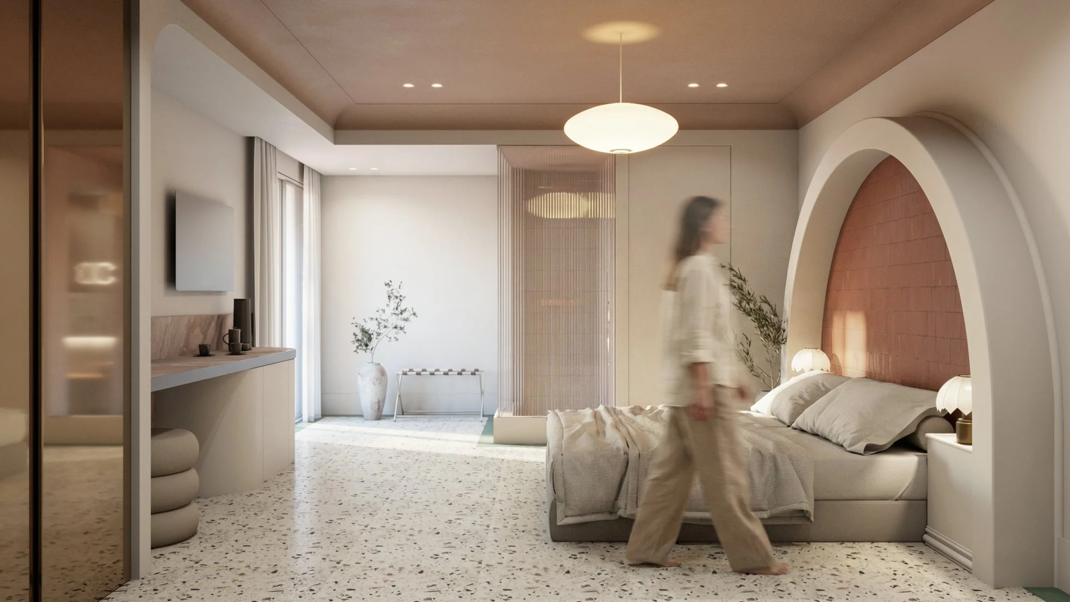 Modern, minimalist bedroom with a neutral color palette, featuring a bed with pillows and bedside lamps, a woman walking past, a terrazzo floor, and decorative elements like a potted plant and a hanging light fixture.