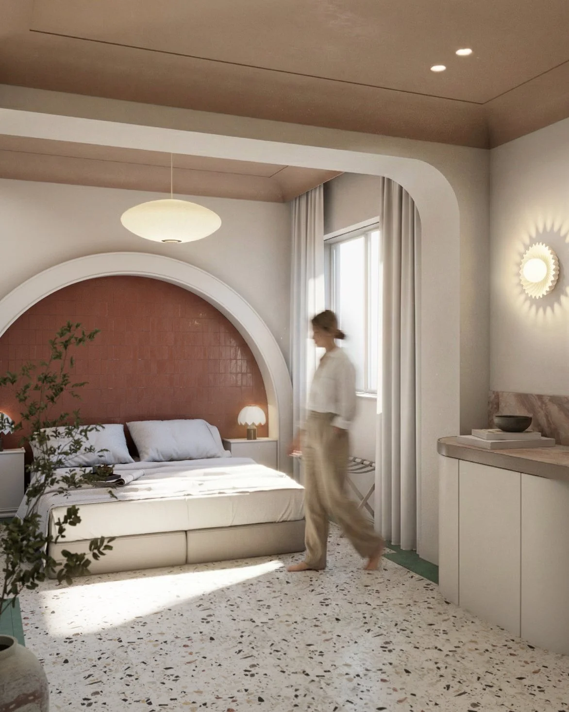 A woman walking barefoot in a modern, minimalist bedroom with natural light from a window, white and earthy tones, a bed with white bedding, a lamp, and decorative elements.