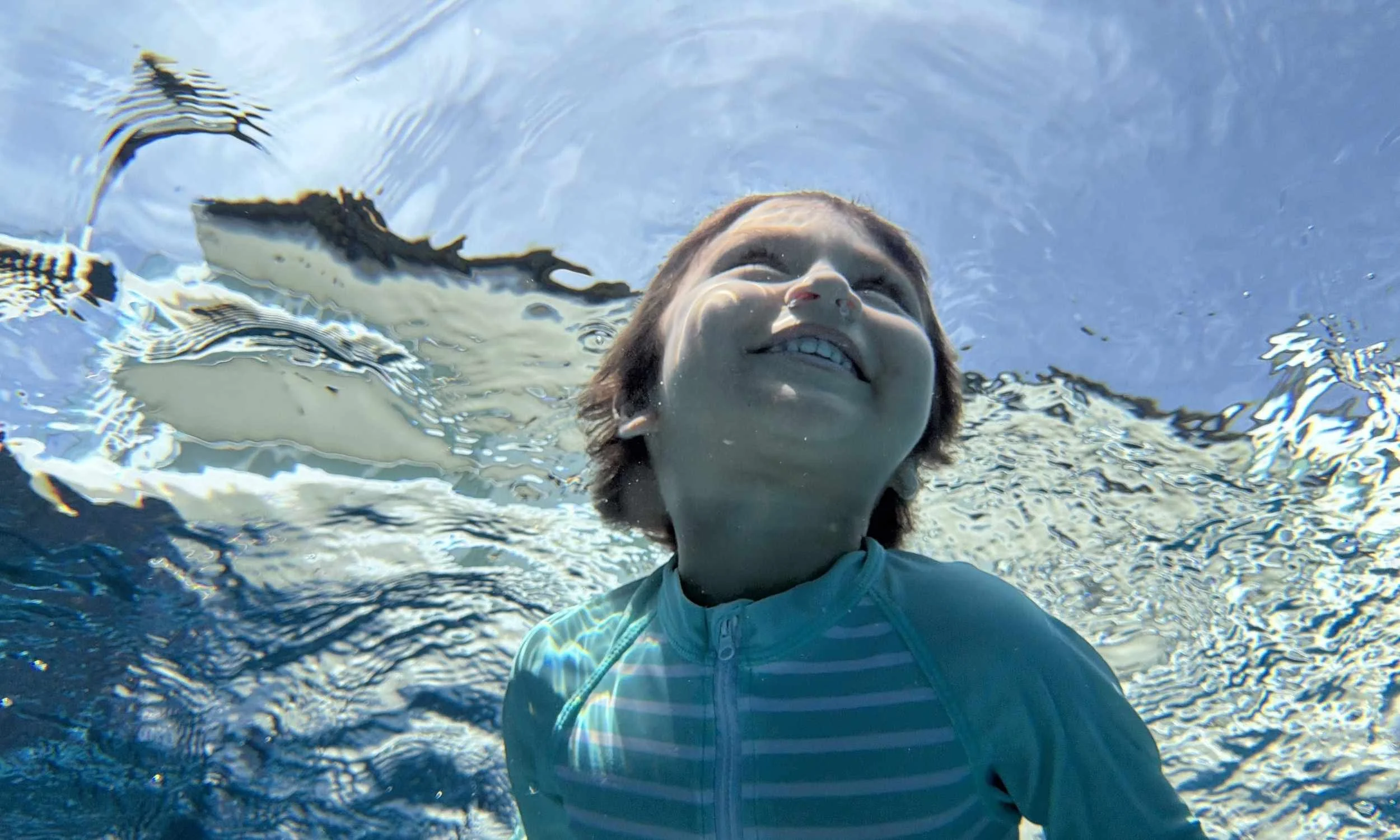 Young student while swimming.