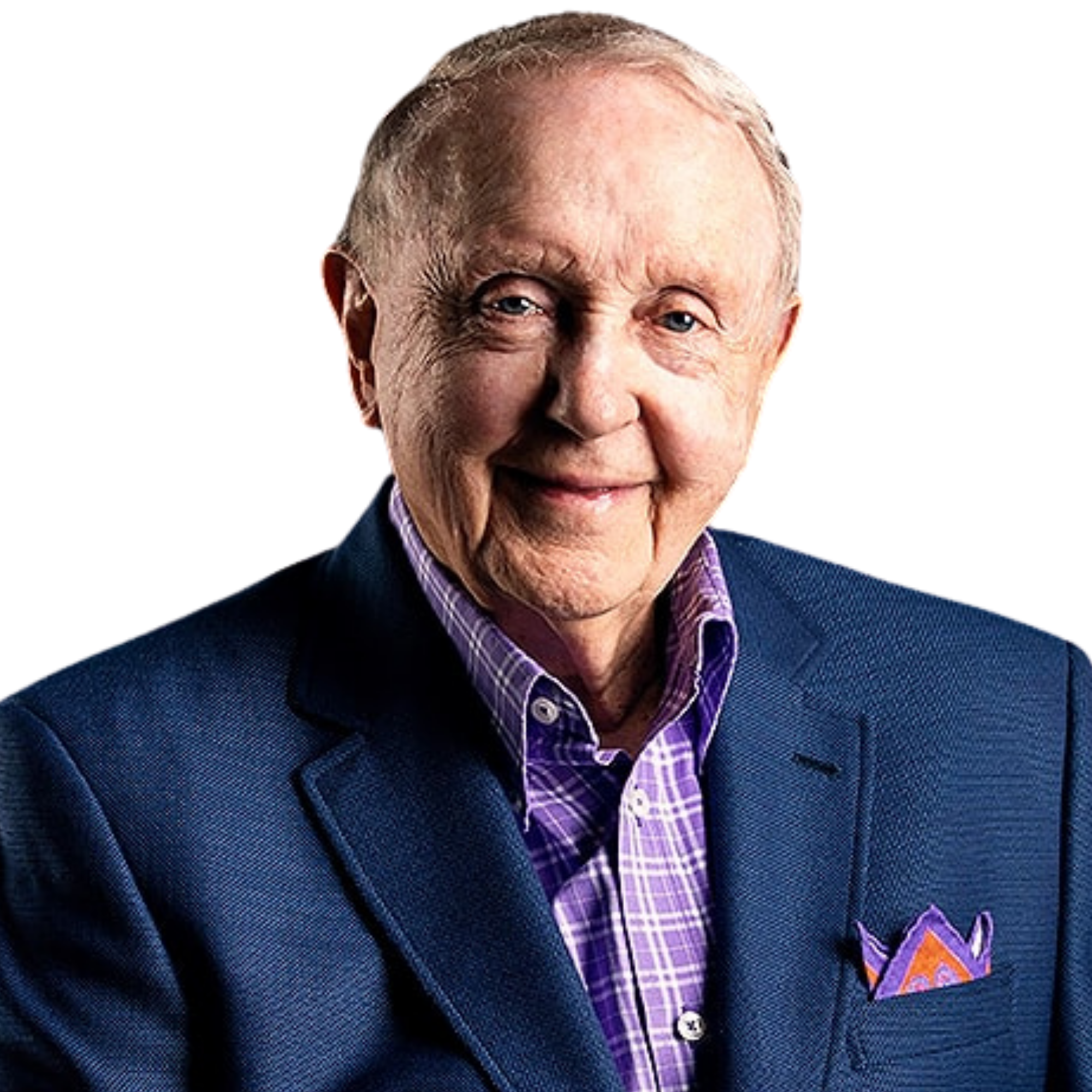 Close-up of an elderly man smiling, wearing a dark blazer, a purple checkered shirt, and a purple pocket square with an orange pattern.