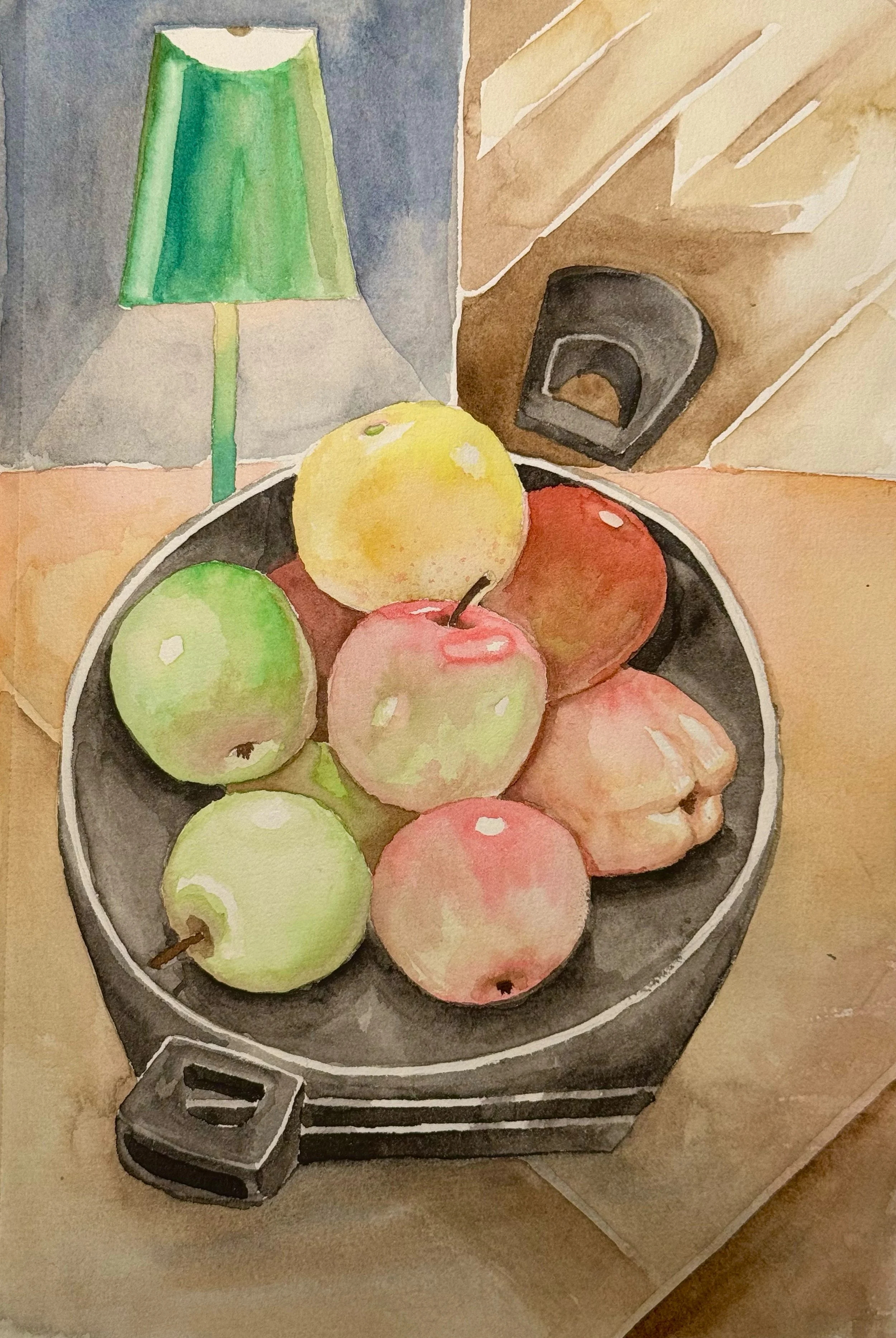 A watercolor painting of a bowl of apples on a wooden table, with a green table lamp in the background and an electric device on the wall.