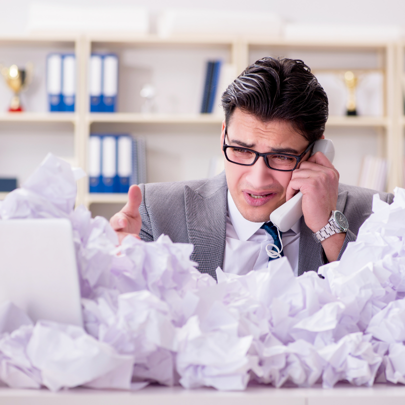 Overloaded with paper files worker