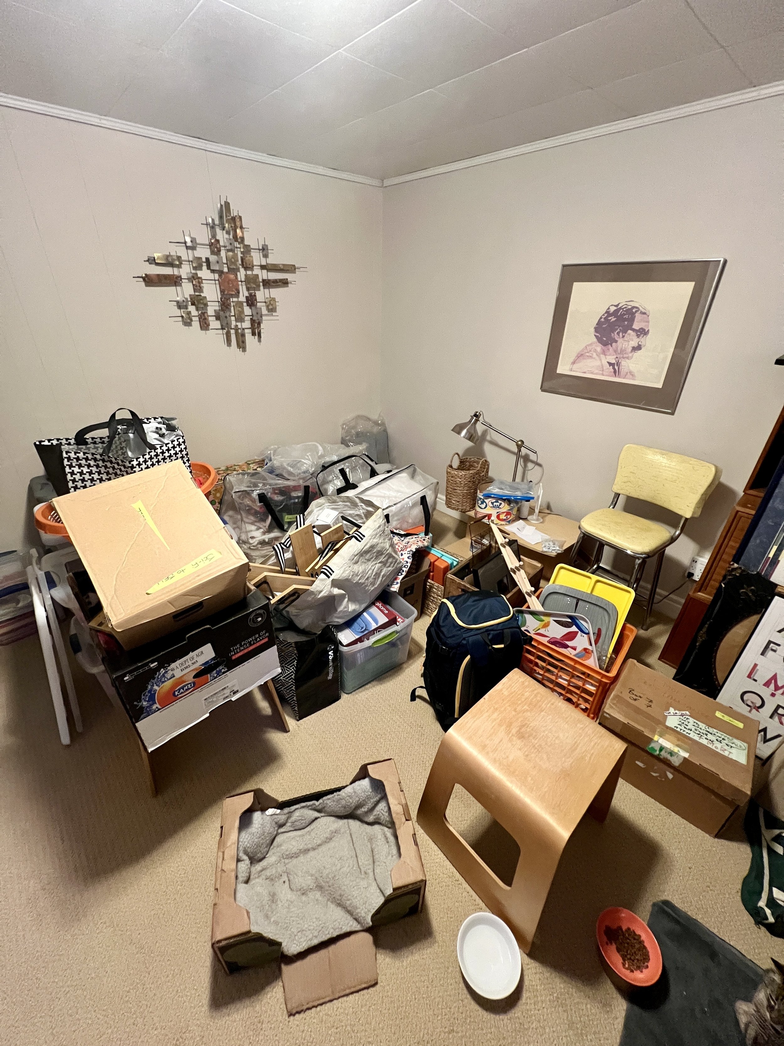 Cluttered spare room, overflowing contents and clutter.