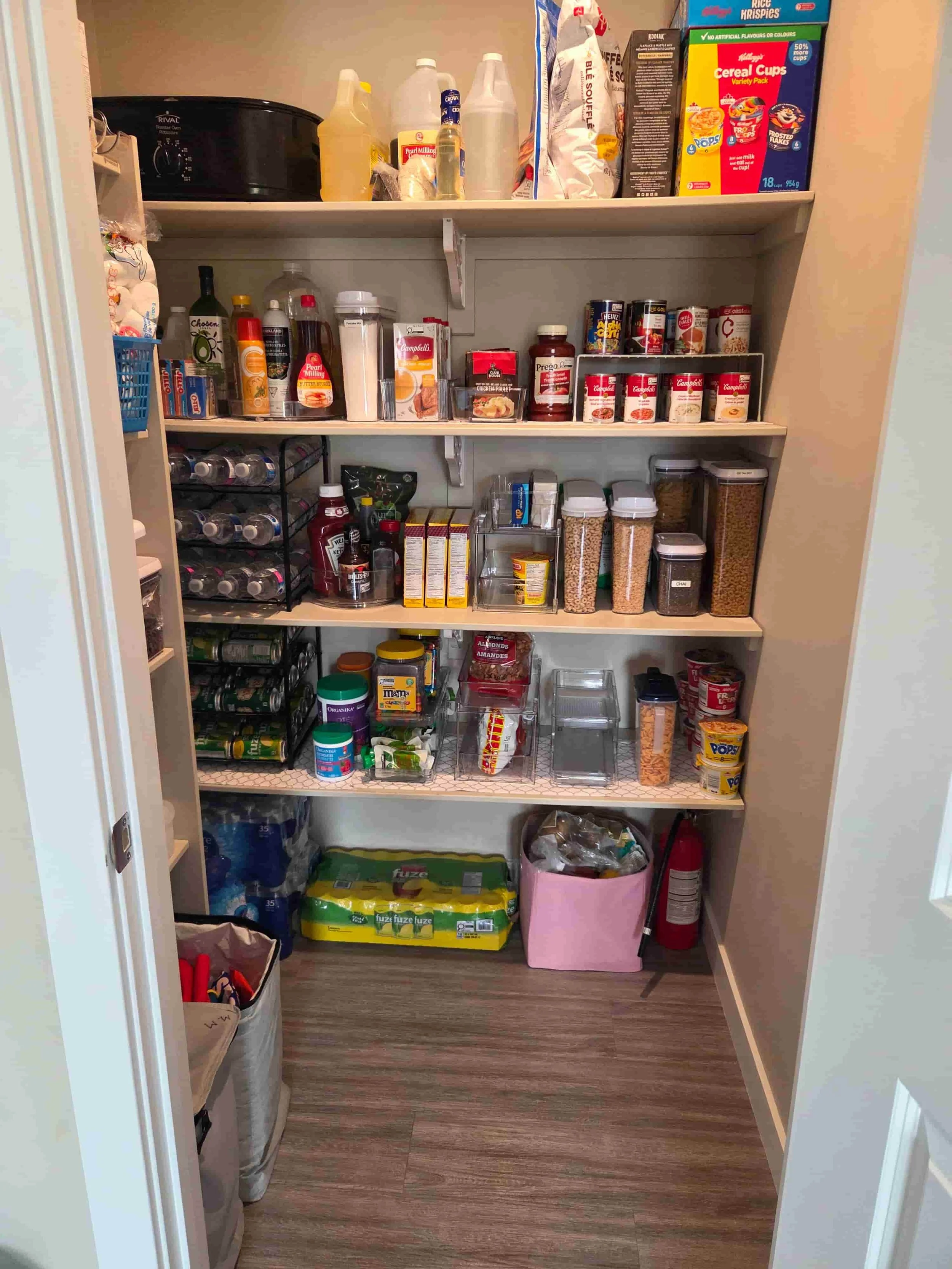 Organized panty with food items neatly labeled and categorized