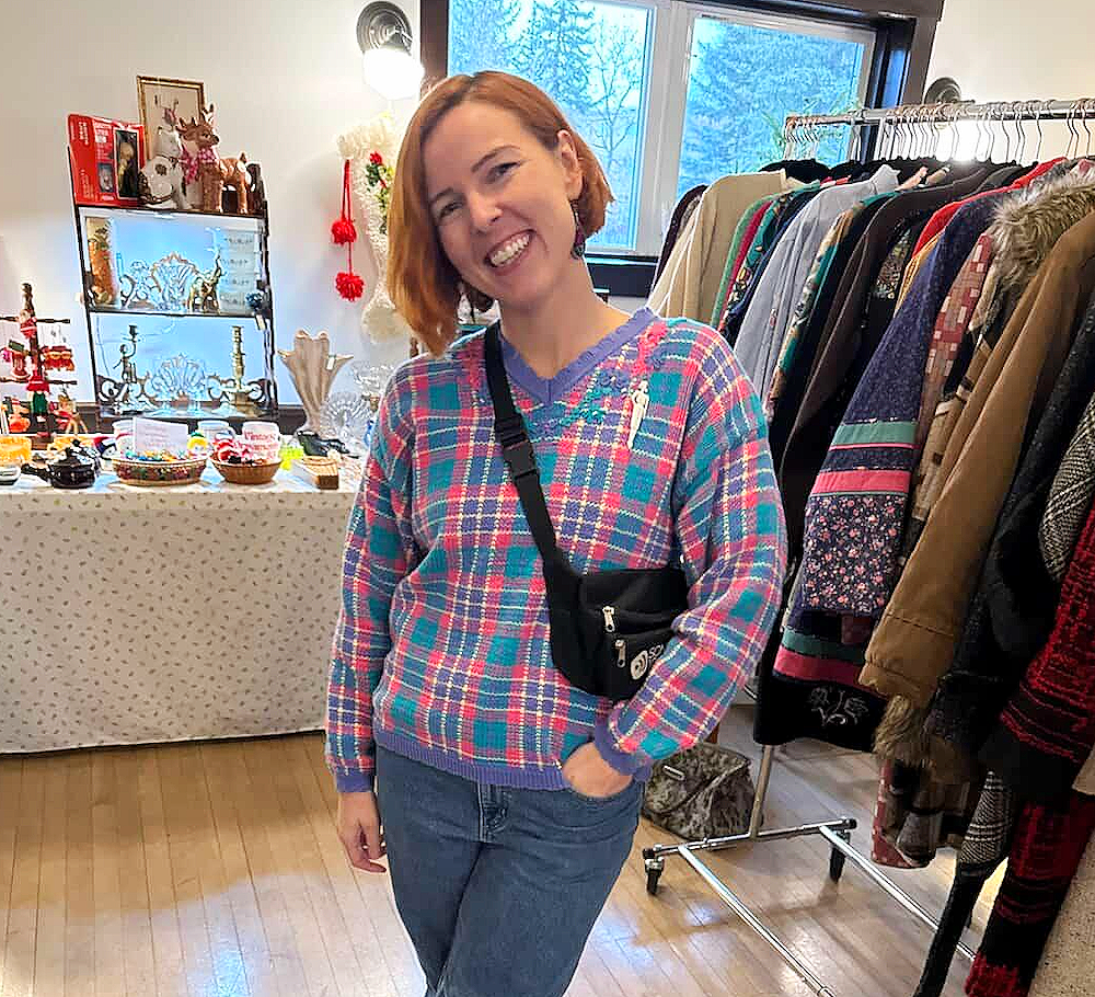 Josie, the organization coach standing smiling at a market