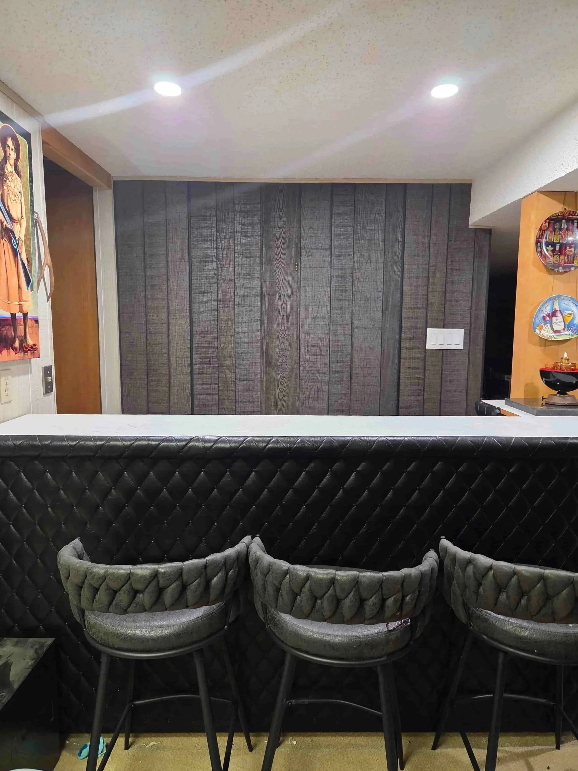 Basement bar area, with clear counter surface and seating area