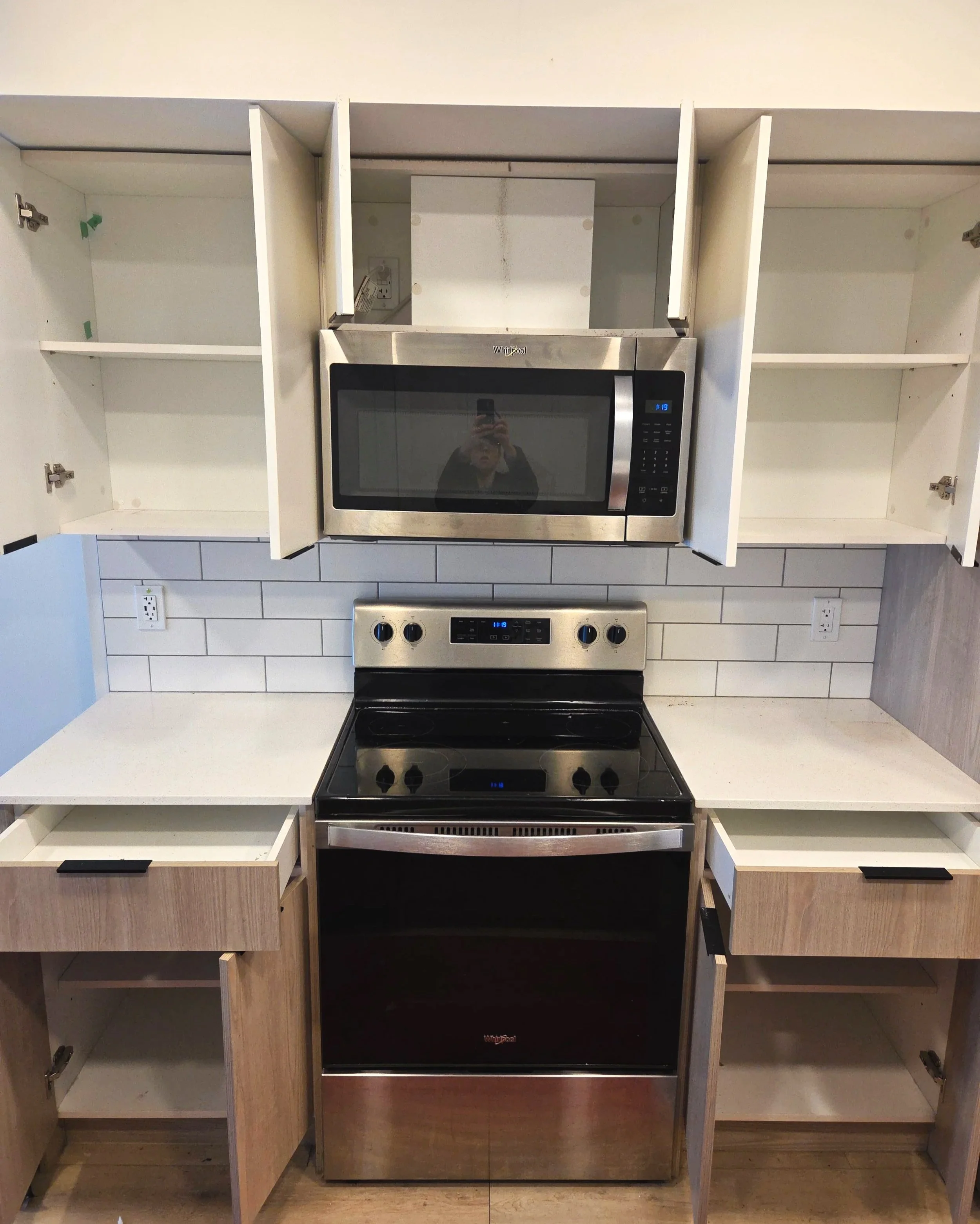 Freshly emptied and cleaned cupboards in a kitchen for move prep session