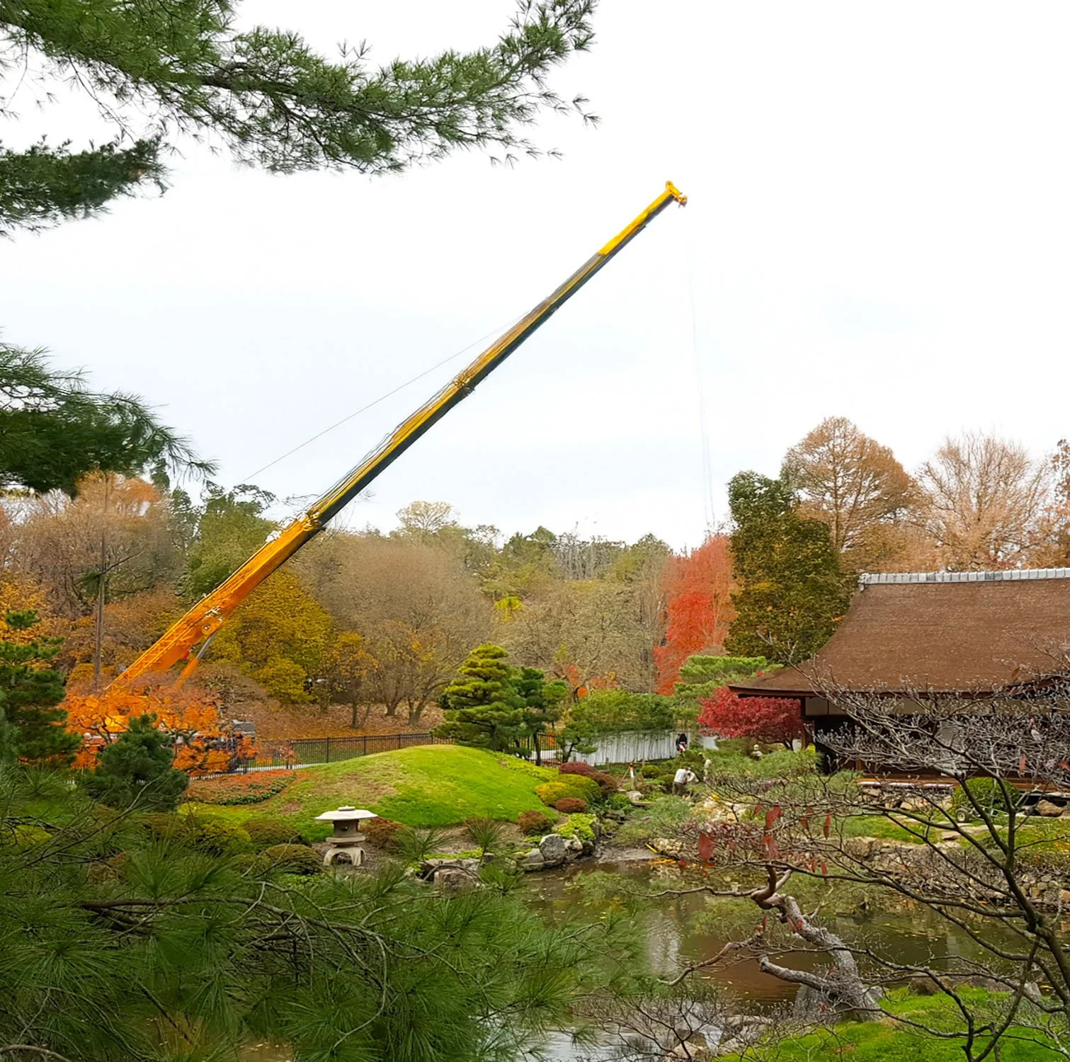 Crane used to bring boulders into Public Japanese Garden in Philadelphia