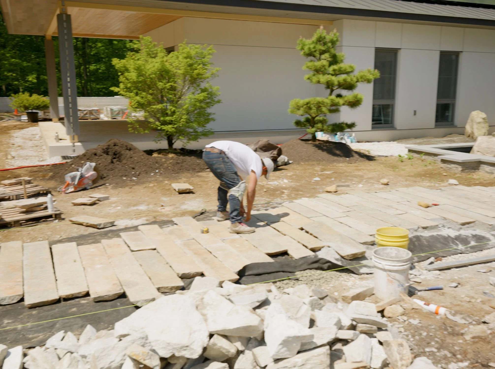 Antique granite paving stones used to make a walkway for a Japanese Koi Pond garden