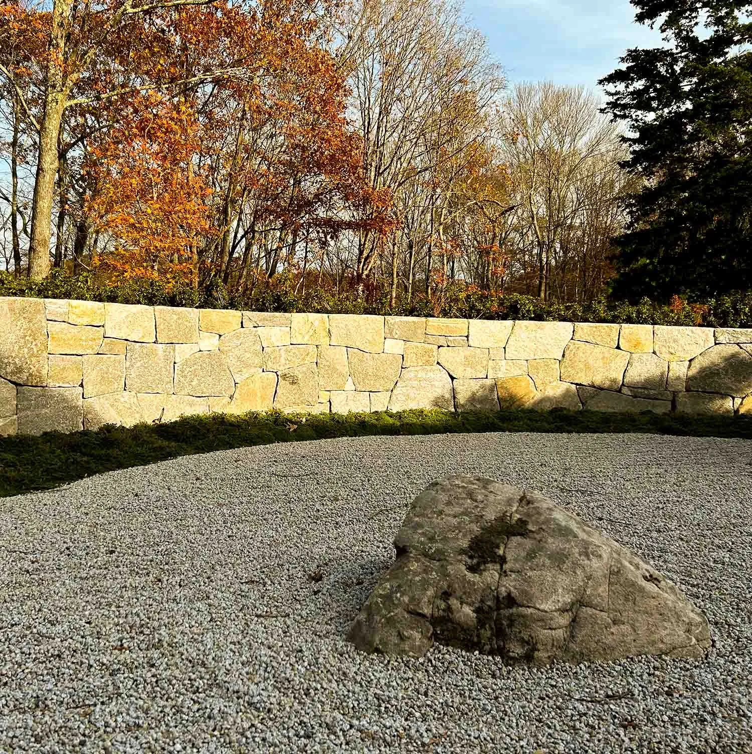 Japanese rock wall surrounding meditation garden