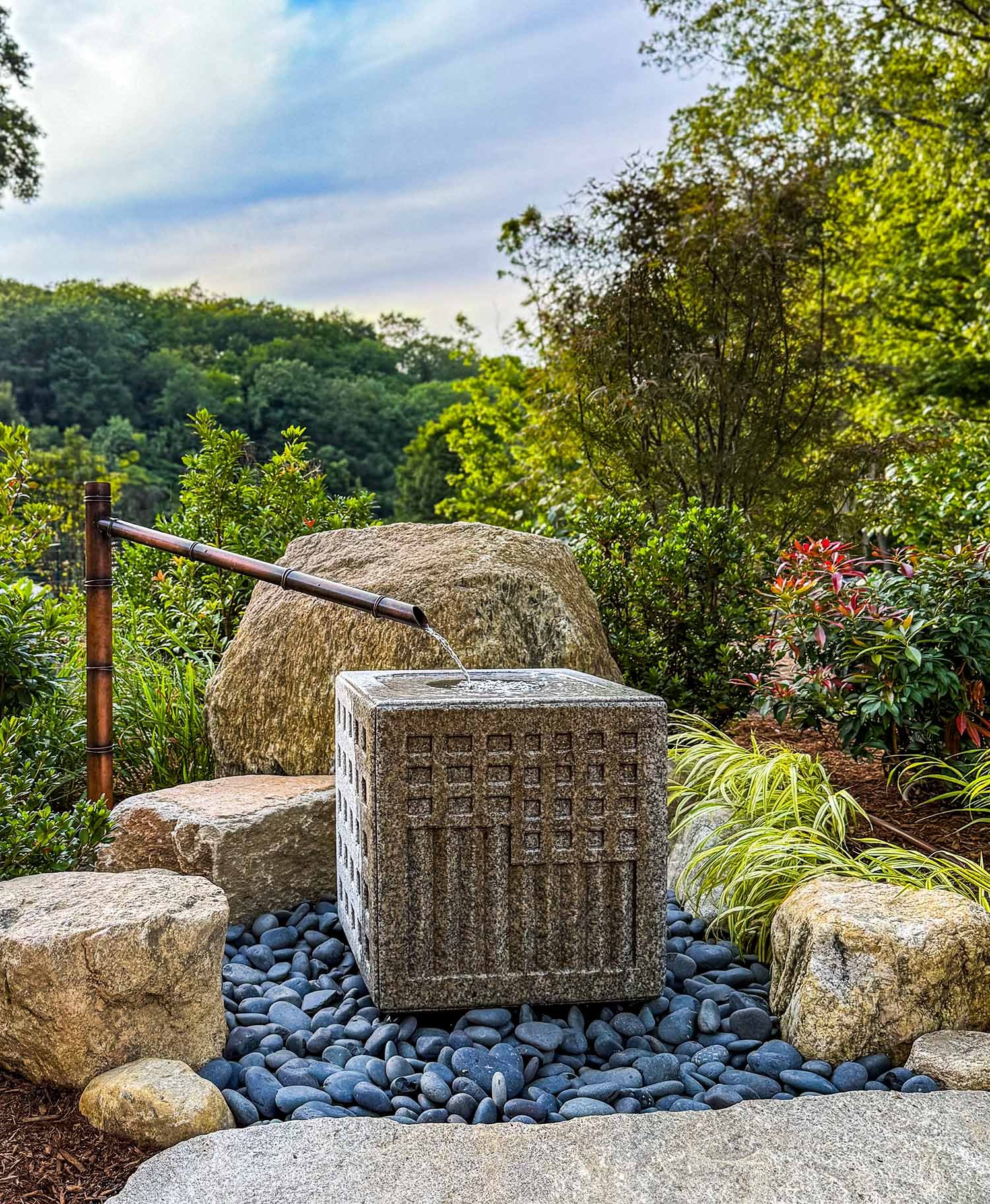 Japanese carved granite water basin with copper water spout