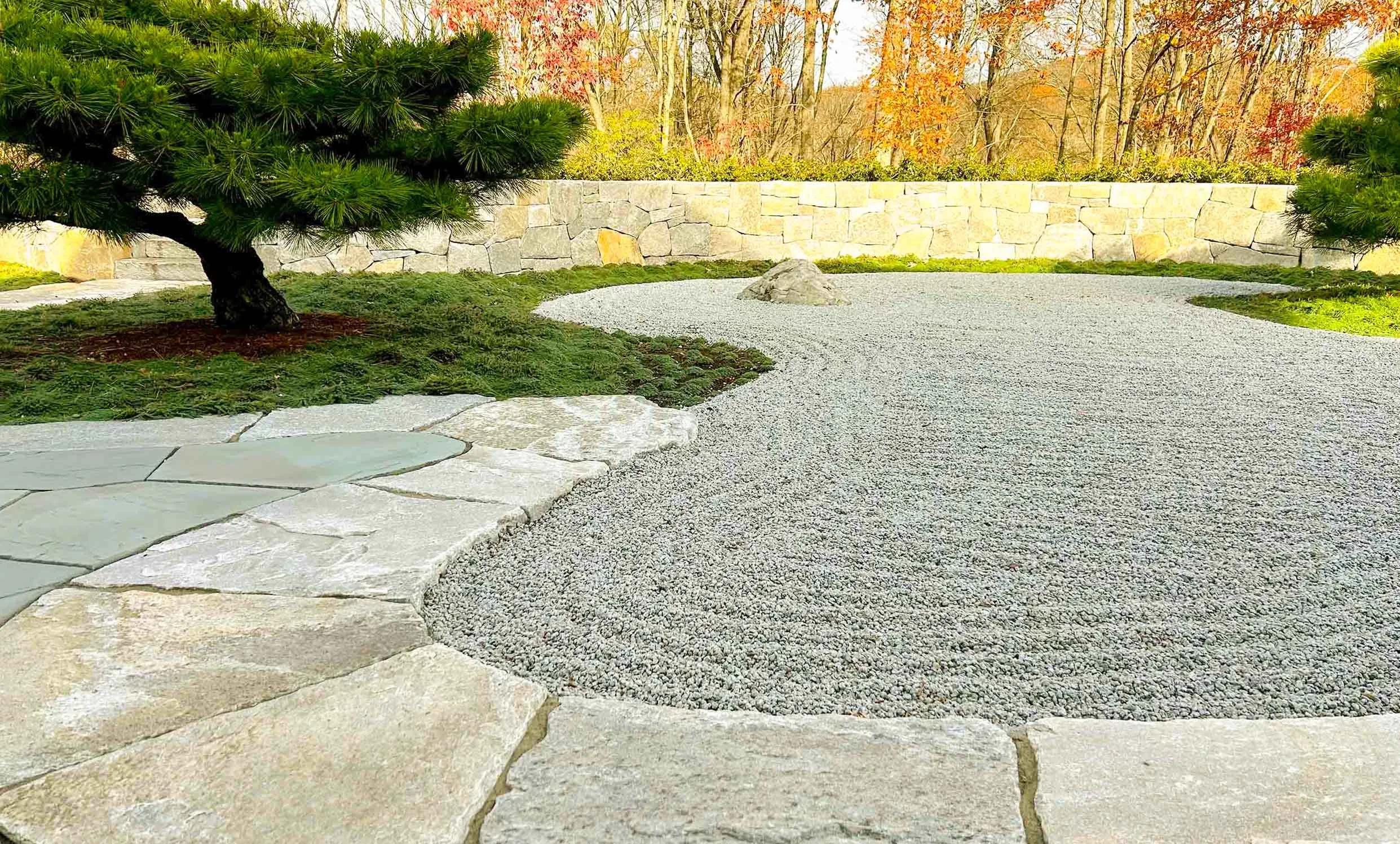 Japanese contemplative garden, or "Zen" garden, for home office with raked gravel, stones and pine trees