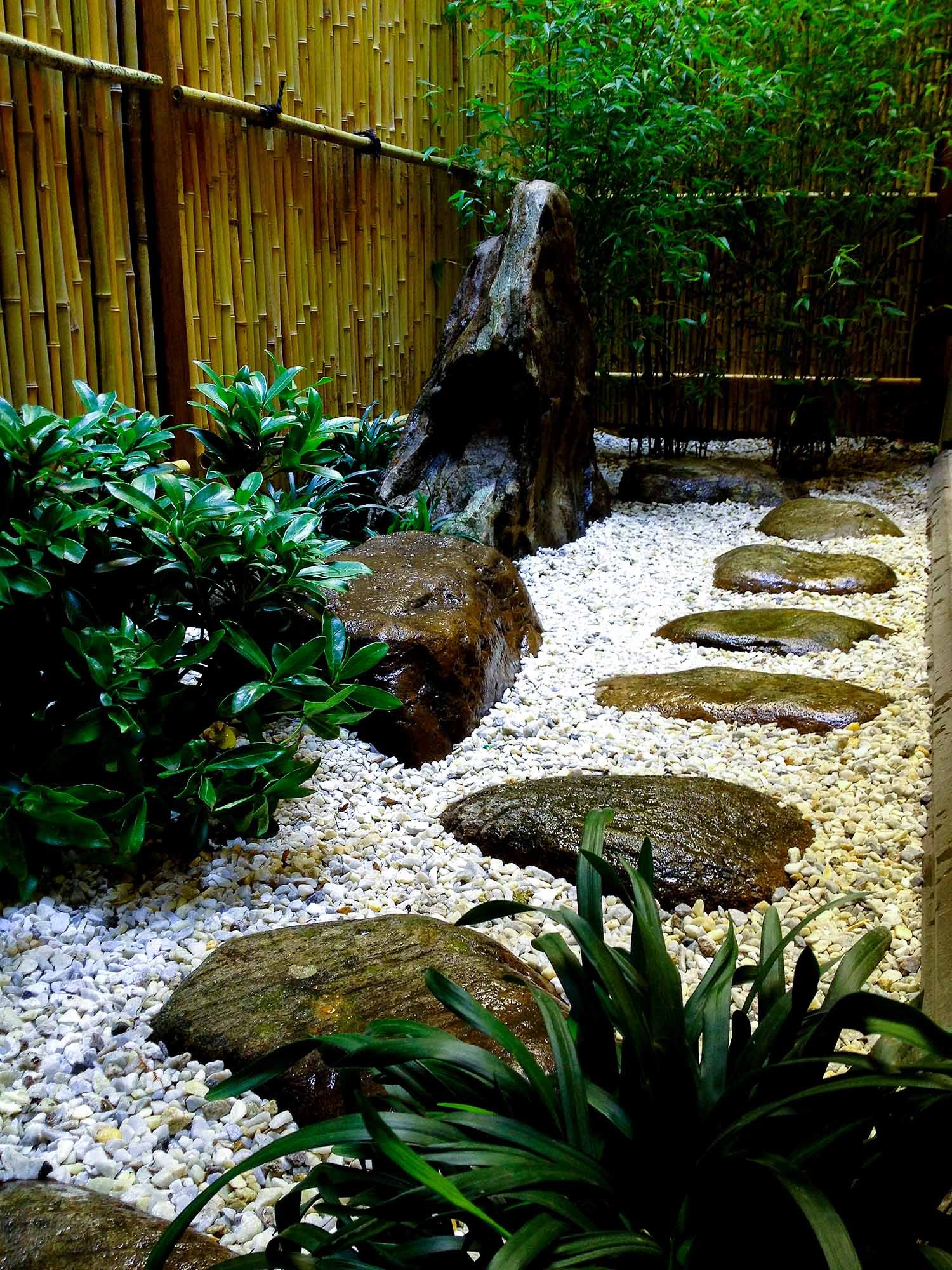 Small urban Japanese garden for Japanese Restaurant in NYC with bamboo fence and rocks