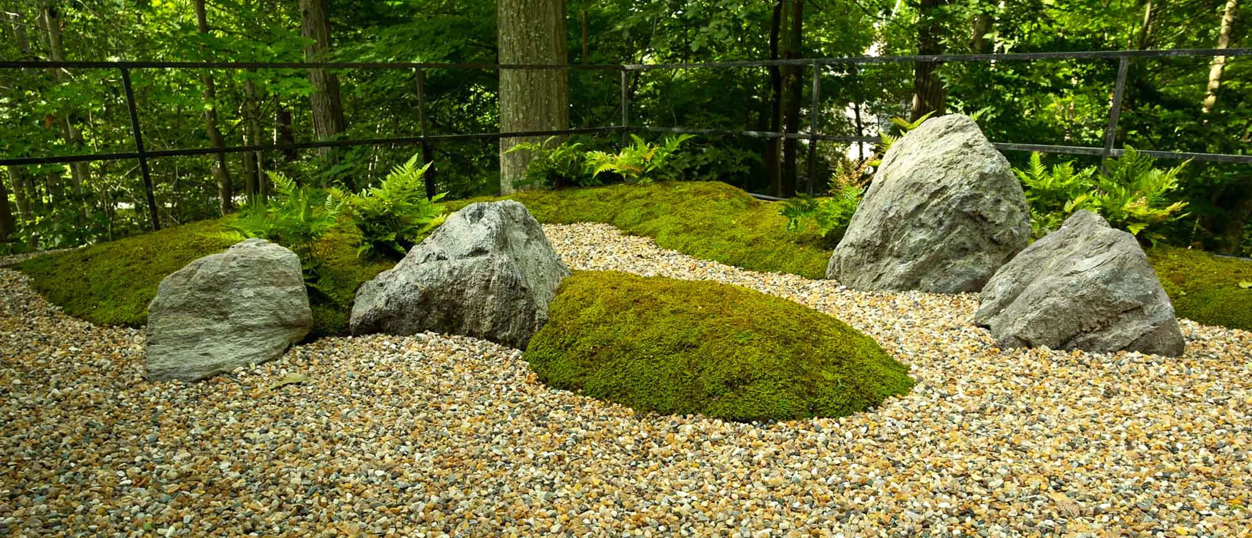 Japanese rooftop moss garden with lightweight rocks, moss and boulders