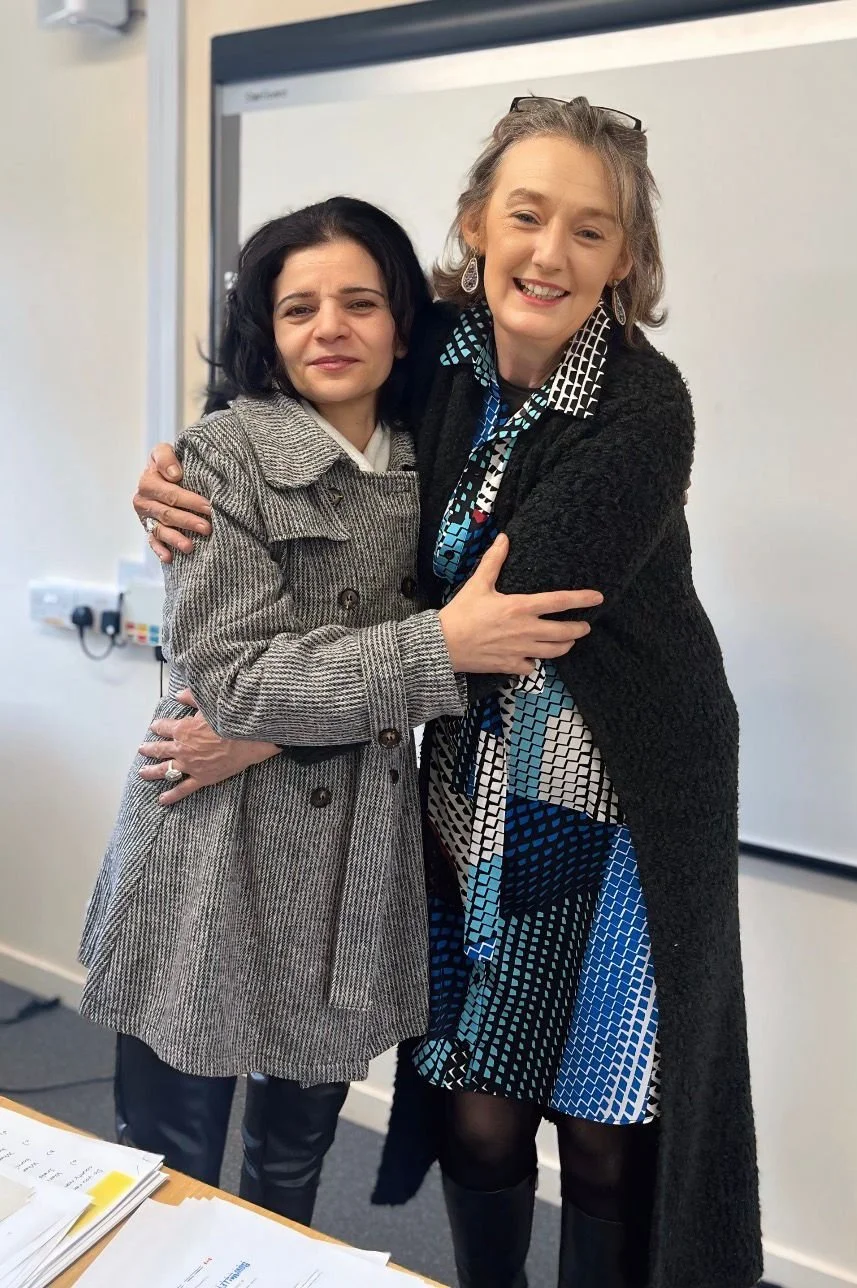 Breda and student take a photo together on their last class together.